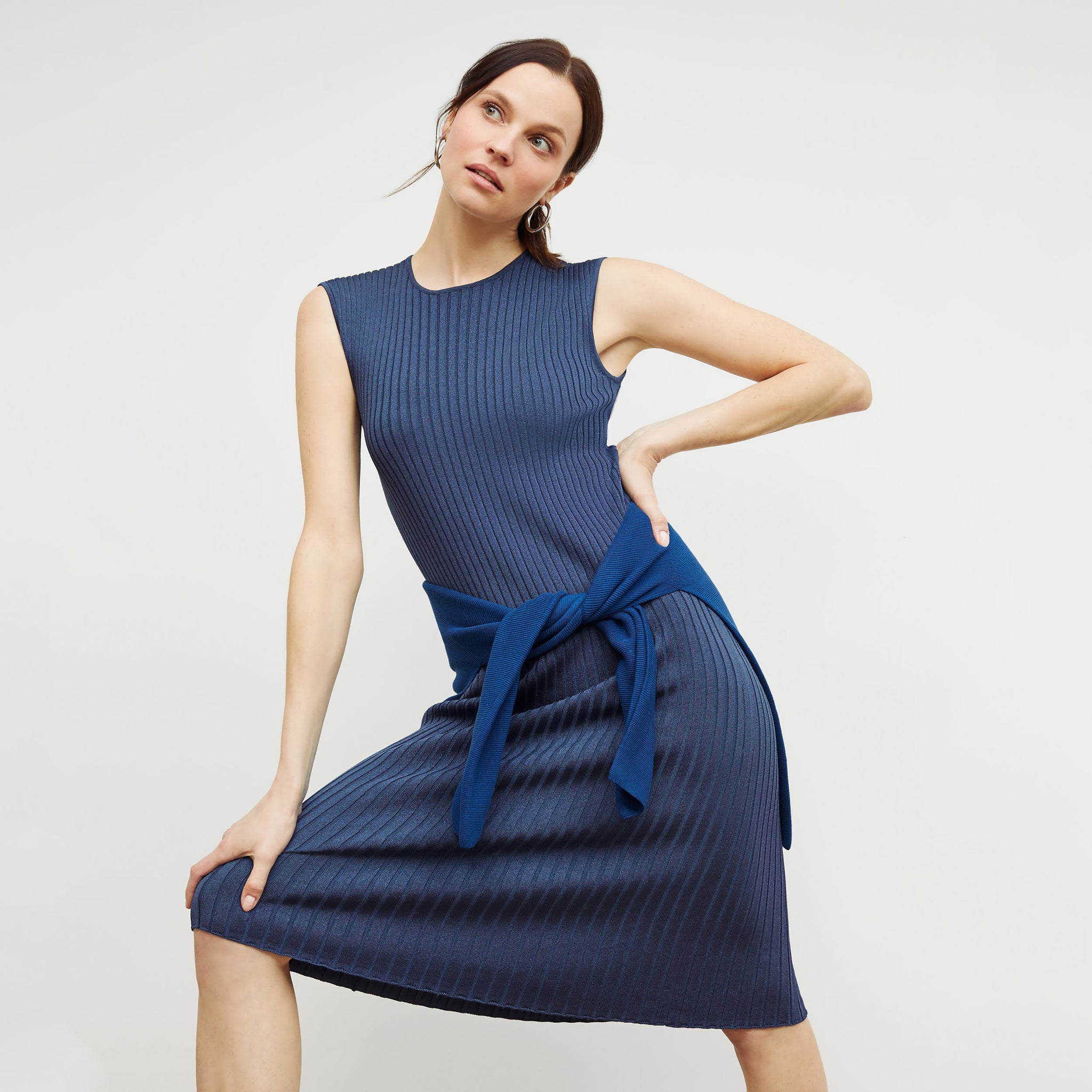 Front image of a woman standing wearing the dylan dress in adriatic blue