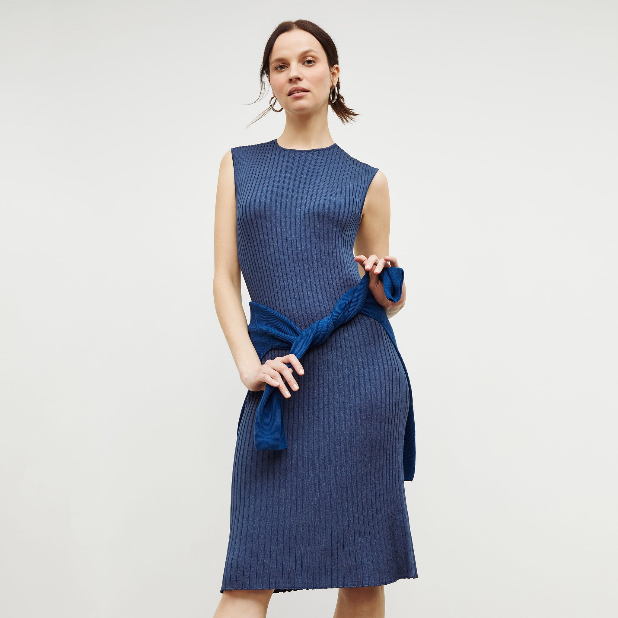 Front image of a woman standing wearing the dylan dress in adriatic blue