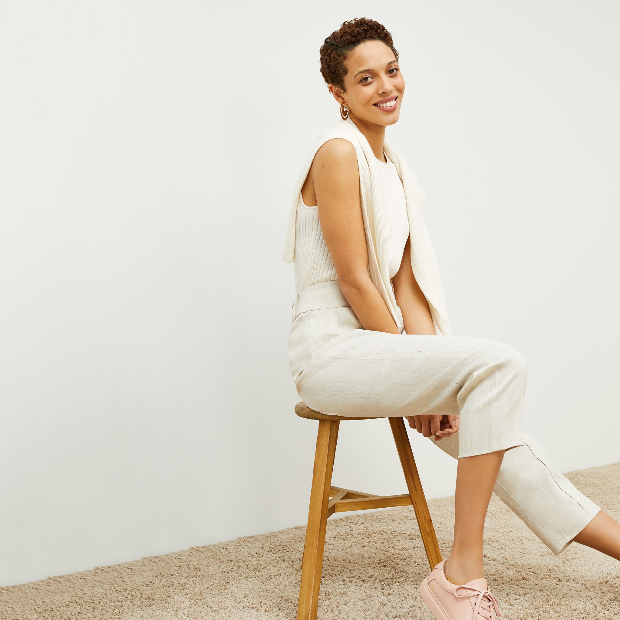 Side image of a woman standing wearing the Chester Pant Slubbed Stretch Linen in Natural