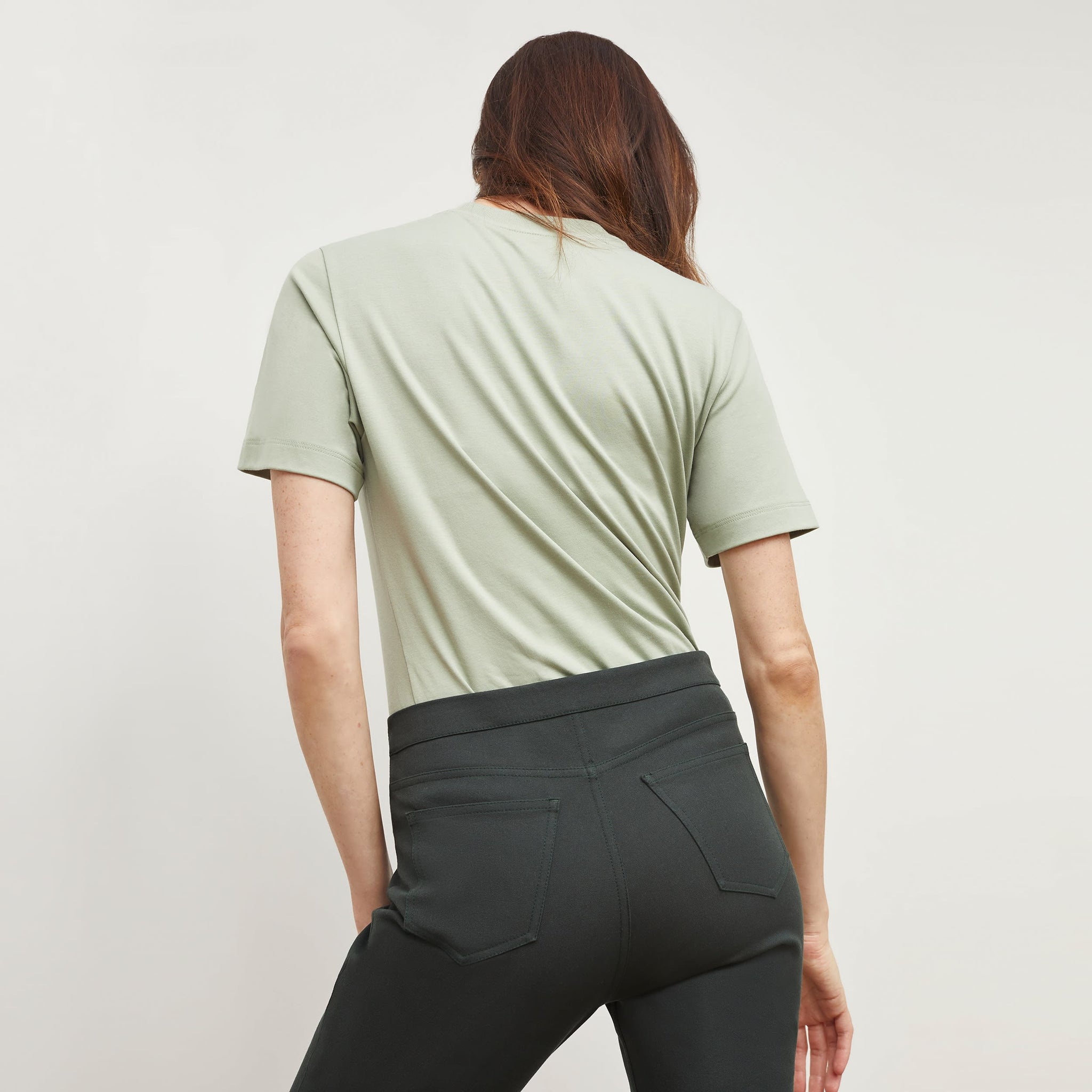 woman wearing the leslie t in minty green