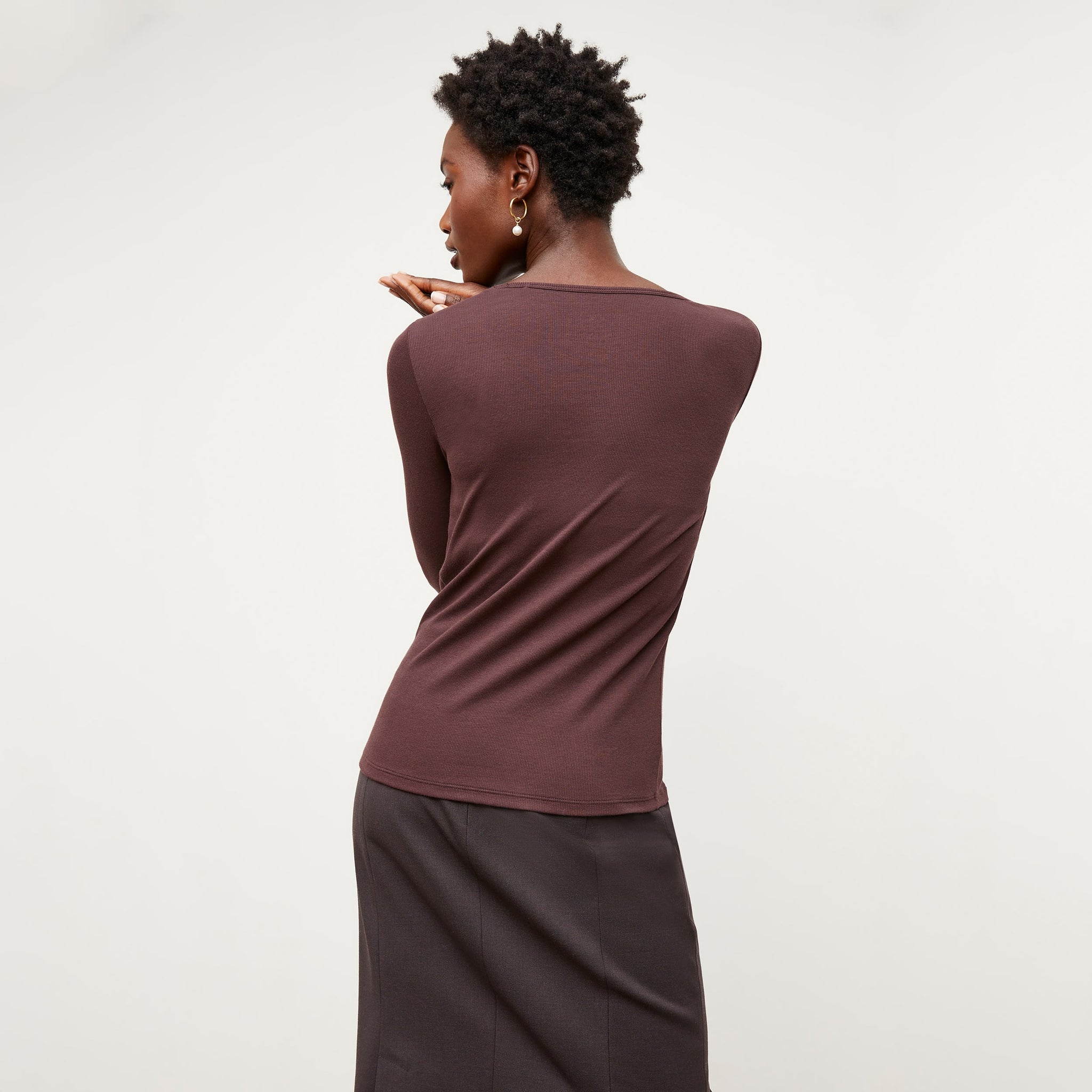 Back image of a woman standing wearing the Marcia T-Shirt--Ribbed Pima Cotton in Huckleberry