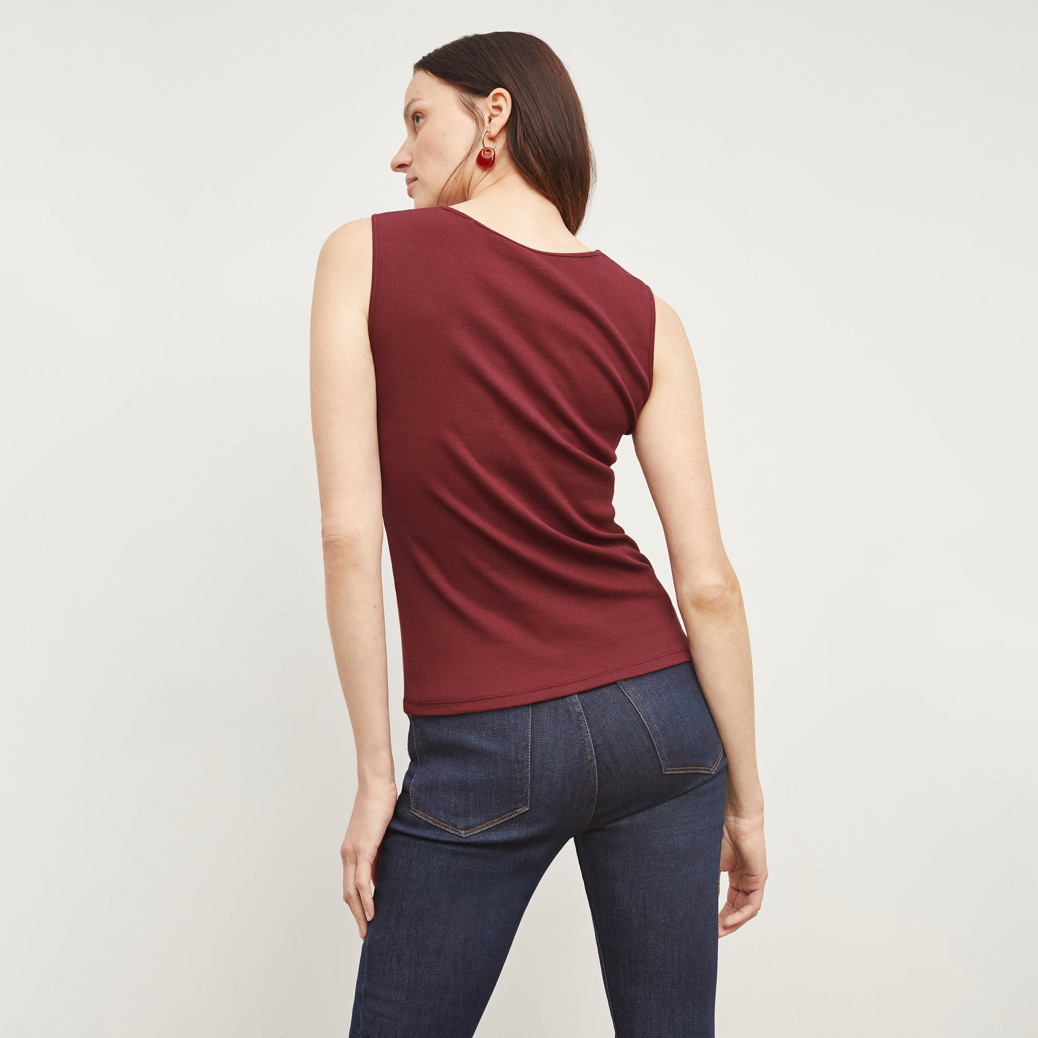 Back image of a woman wearing the Paige Top in Cranberry