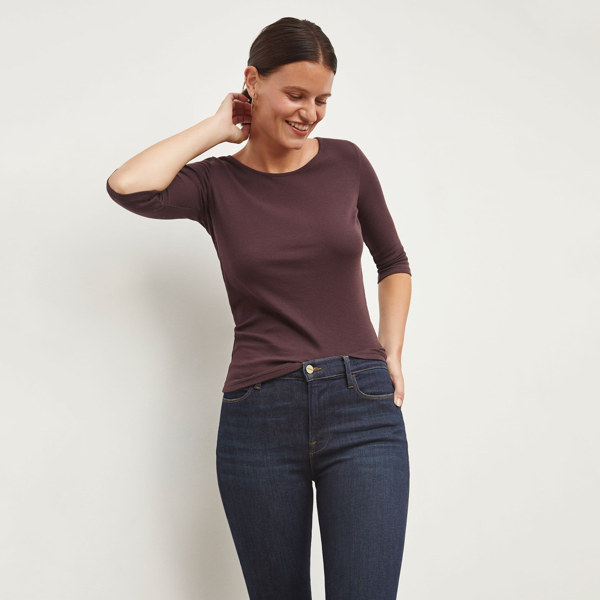 Front image of a woman standing wearing the FRAME Denim Le High Skinny Crop Jean in Samira