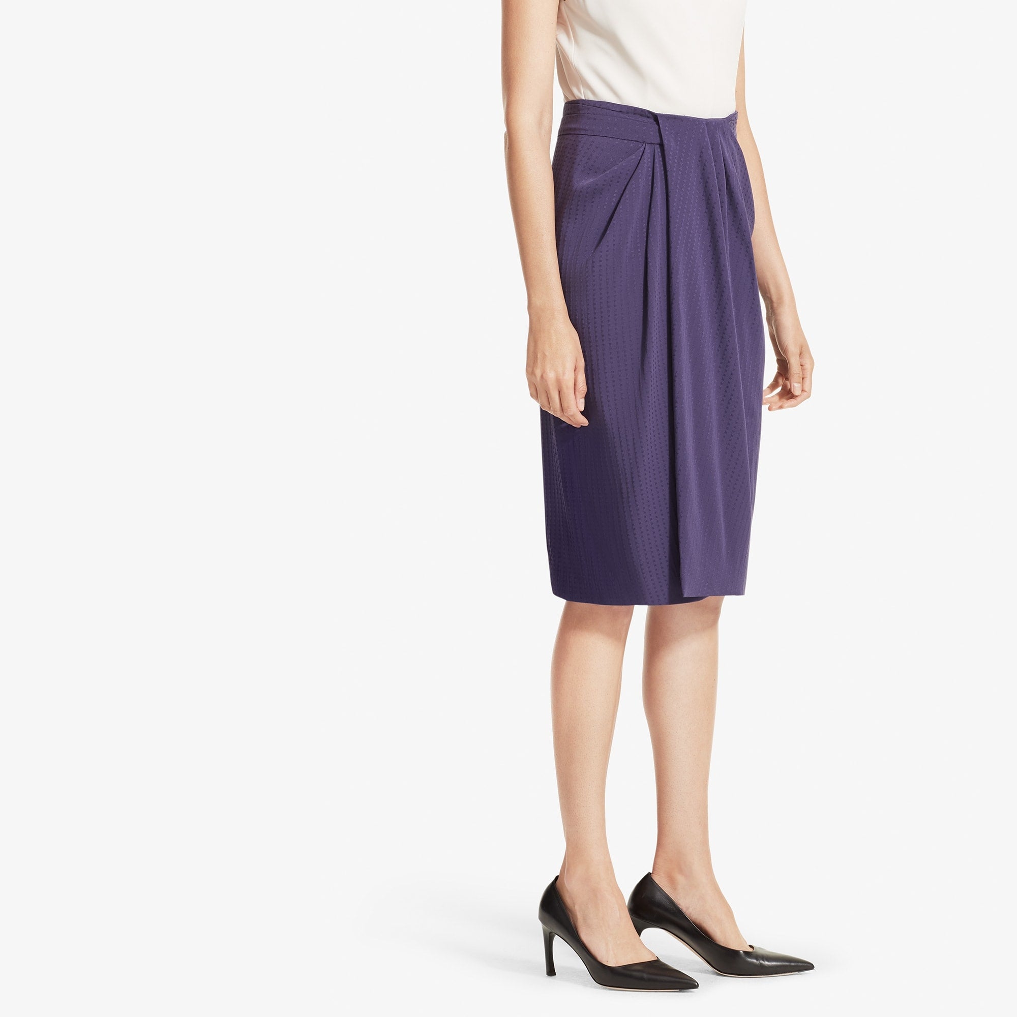 Side image of a woman standing wearing the Lenox skirt foulard in Iolite
