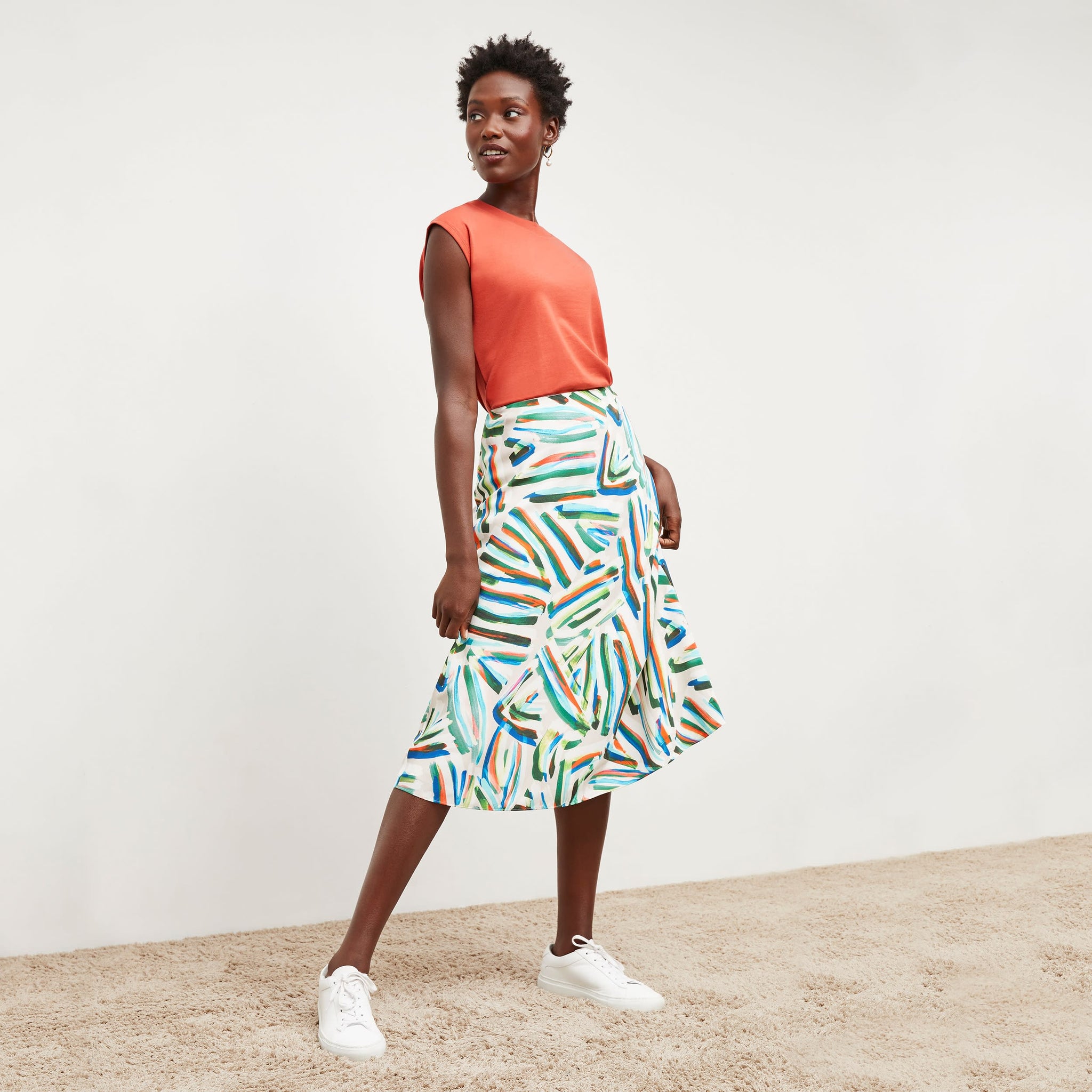 Front image of a woman wearing the orchard skirt in city lights print 