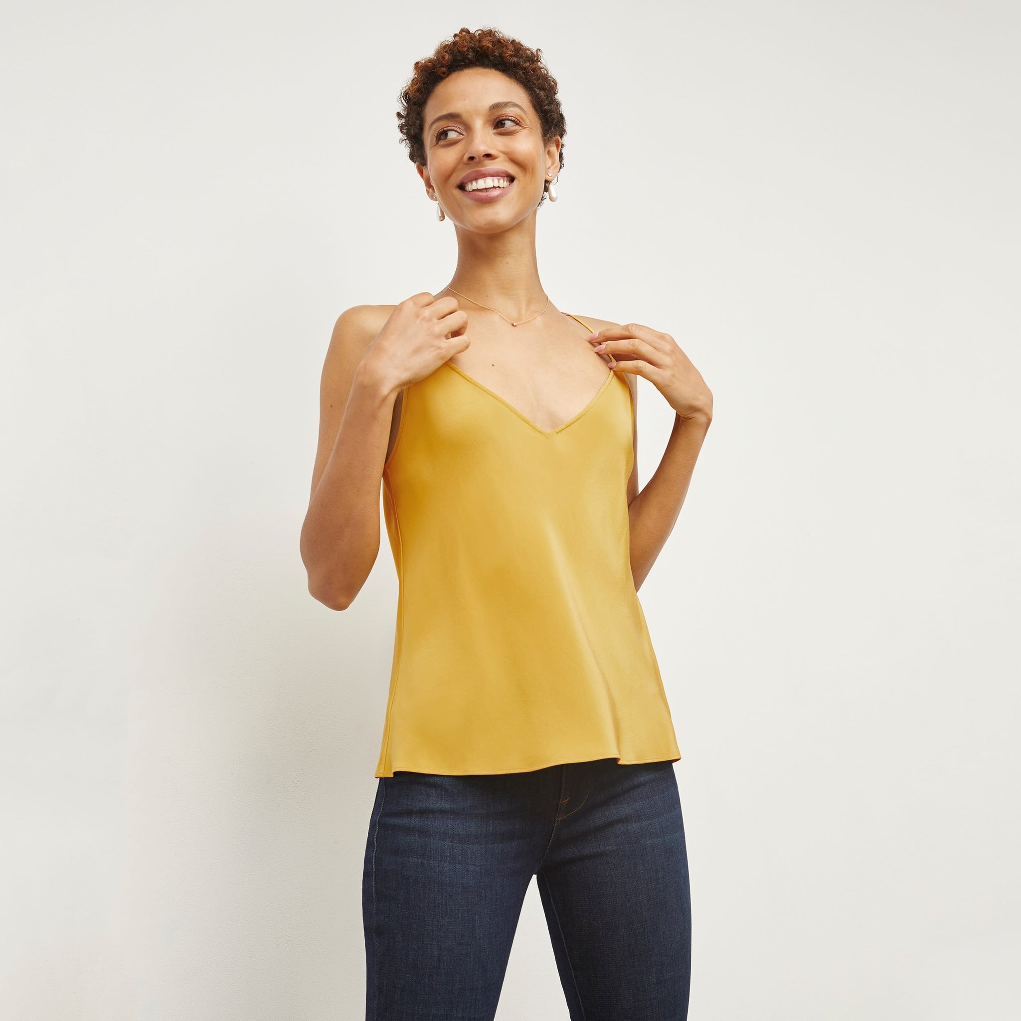 Front image of a woman standing wearing the Lisey Cami—Washable Silk in Dijon 