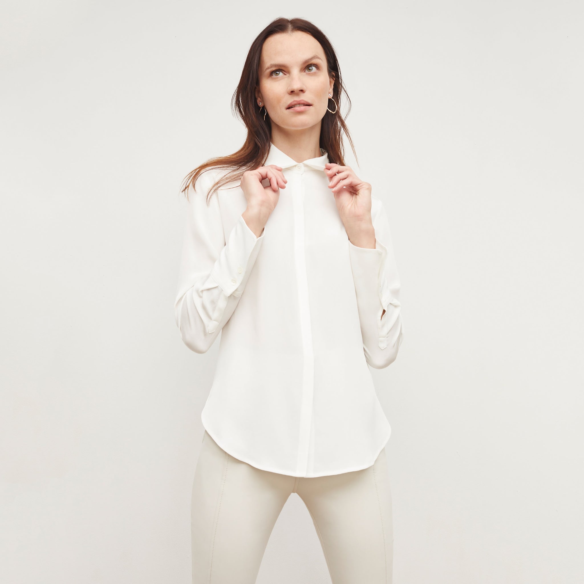 Front image of a woman wearing the tatum shirt in ivory