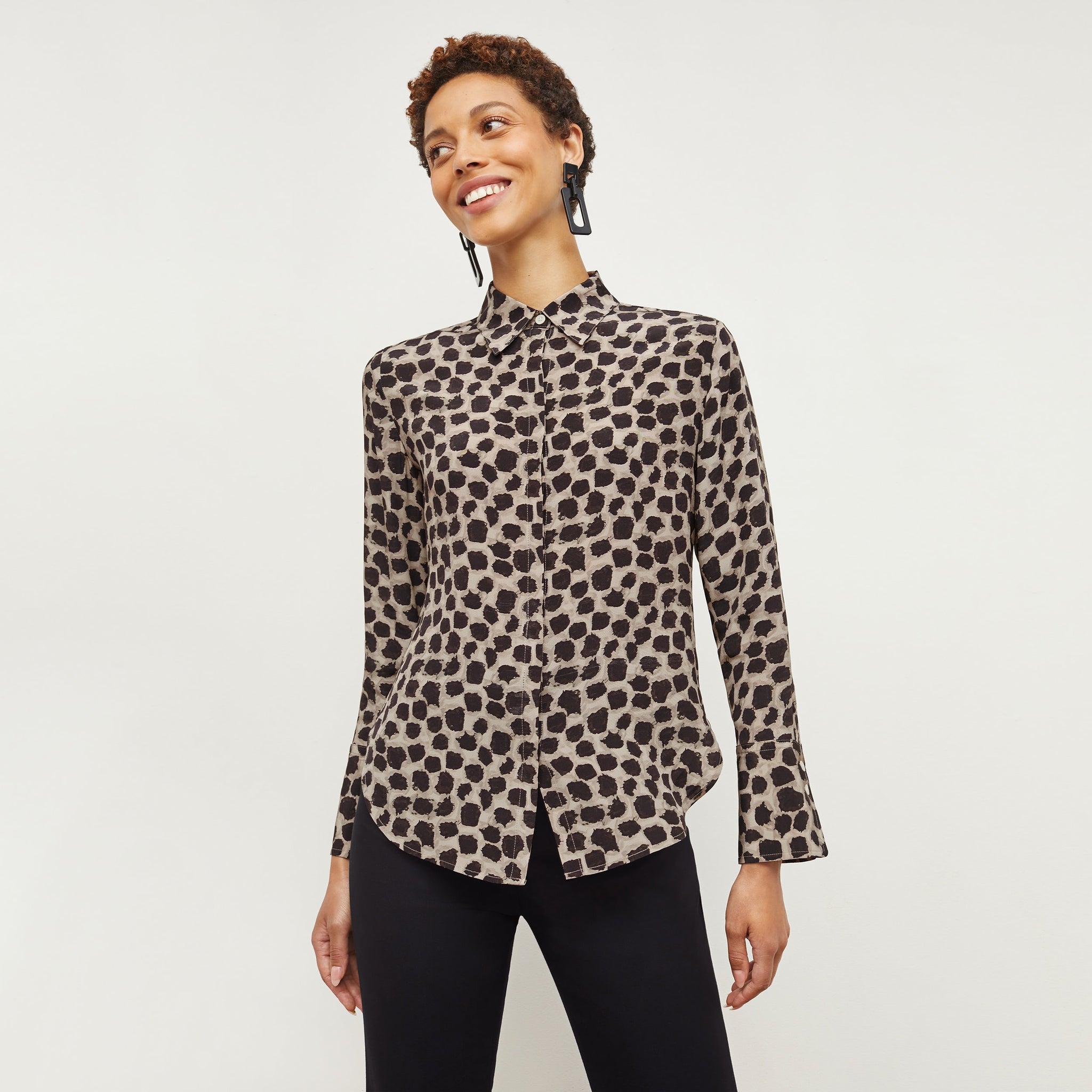 Front image of a woman wearing the tatum shirt in sahara print