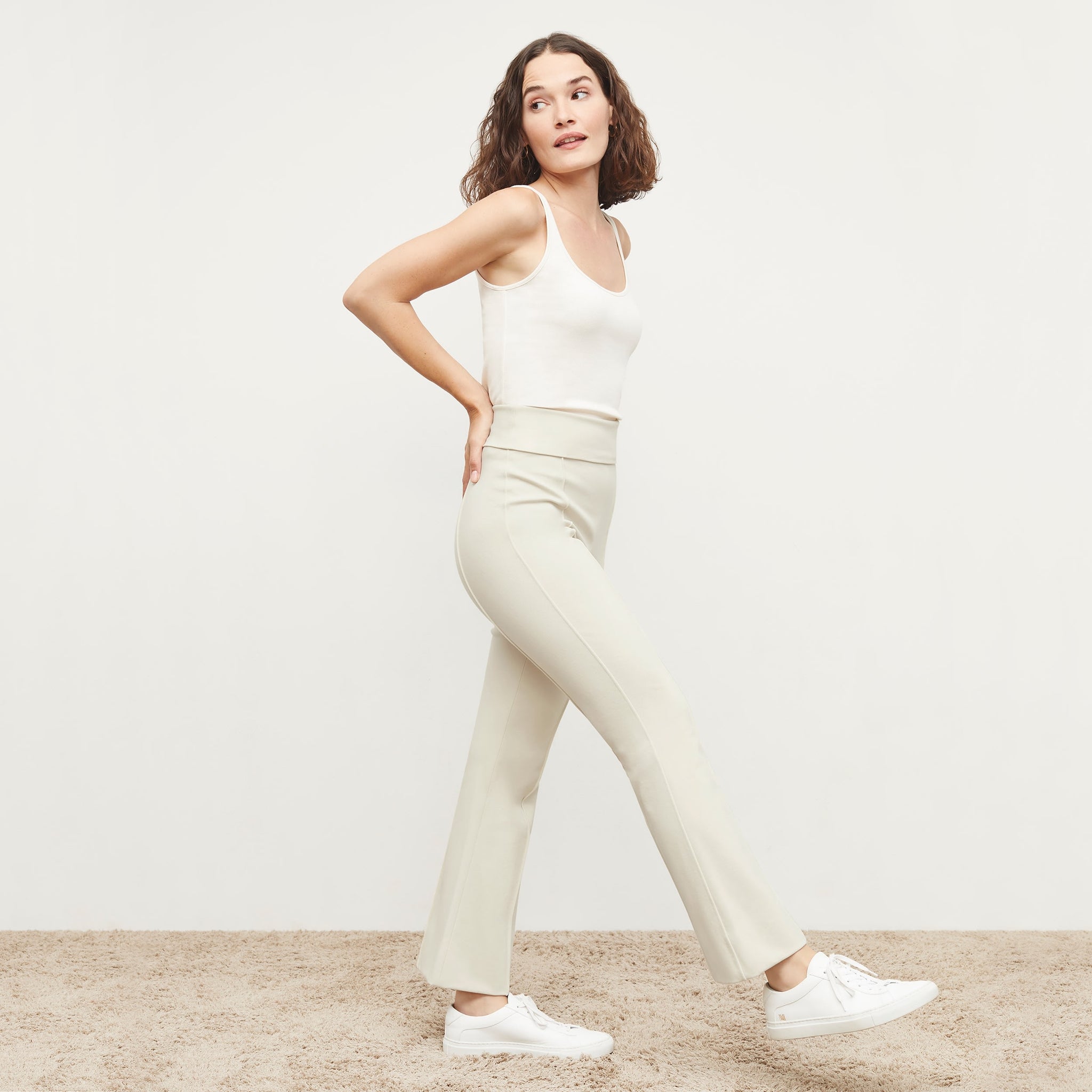 Side image of a woman standing wearing the Shiloh Pant in Pearl