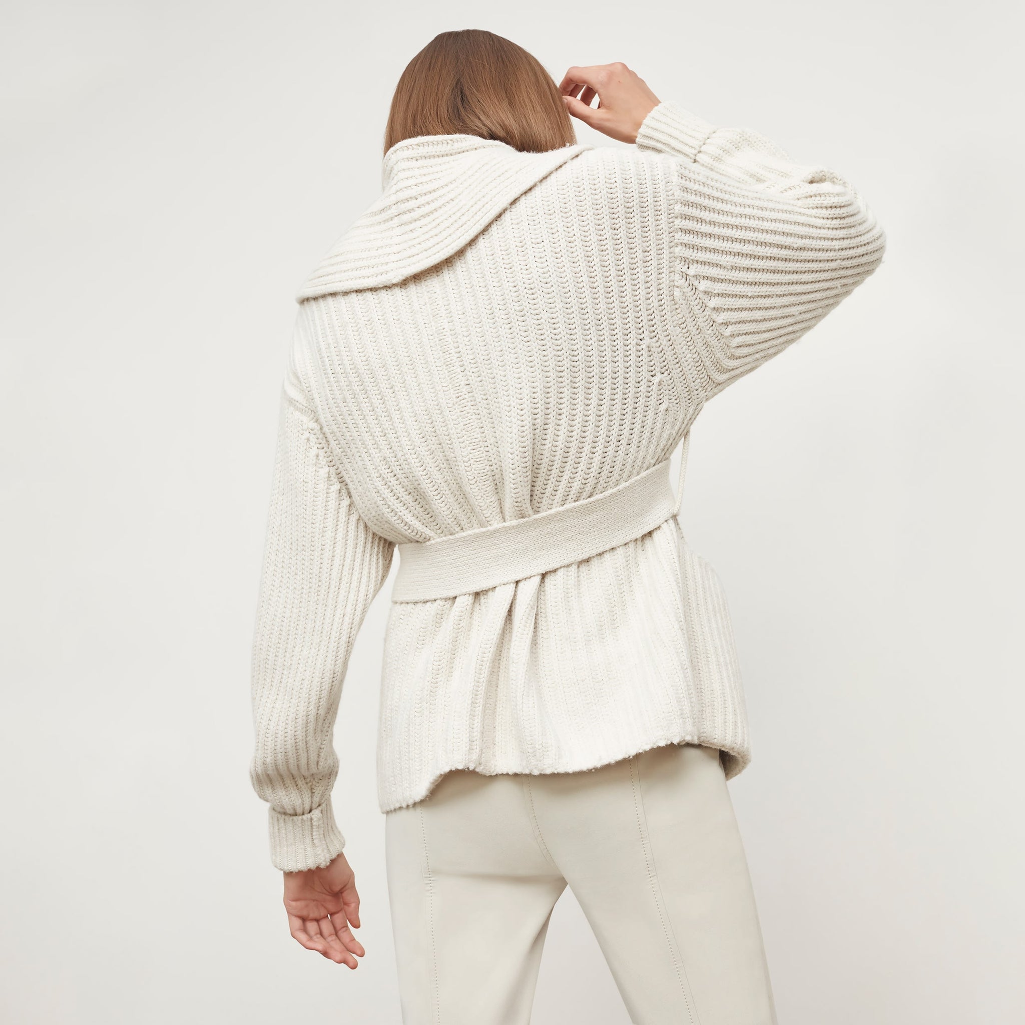 Back image of a woman standing wearing the Snyder Jacket in Ivory
