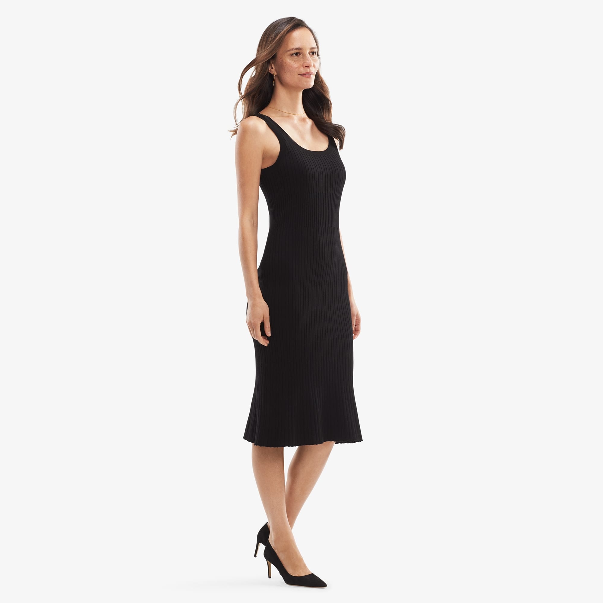 Side image of a woman standing wearing the Gwen Dress in Black