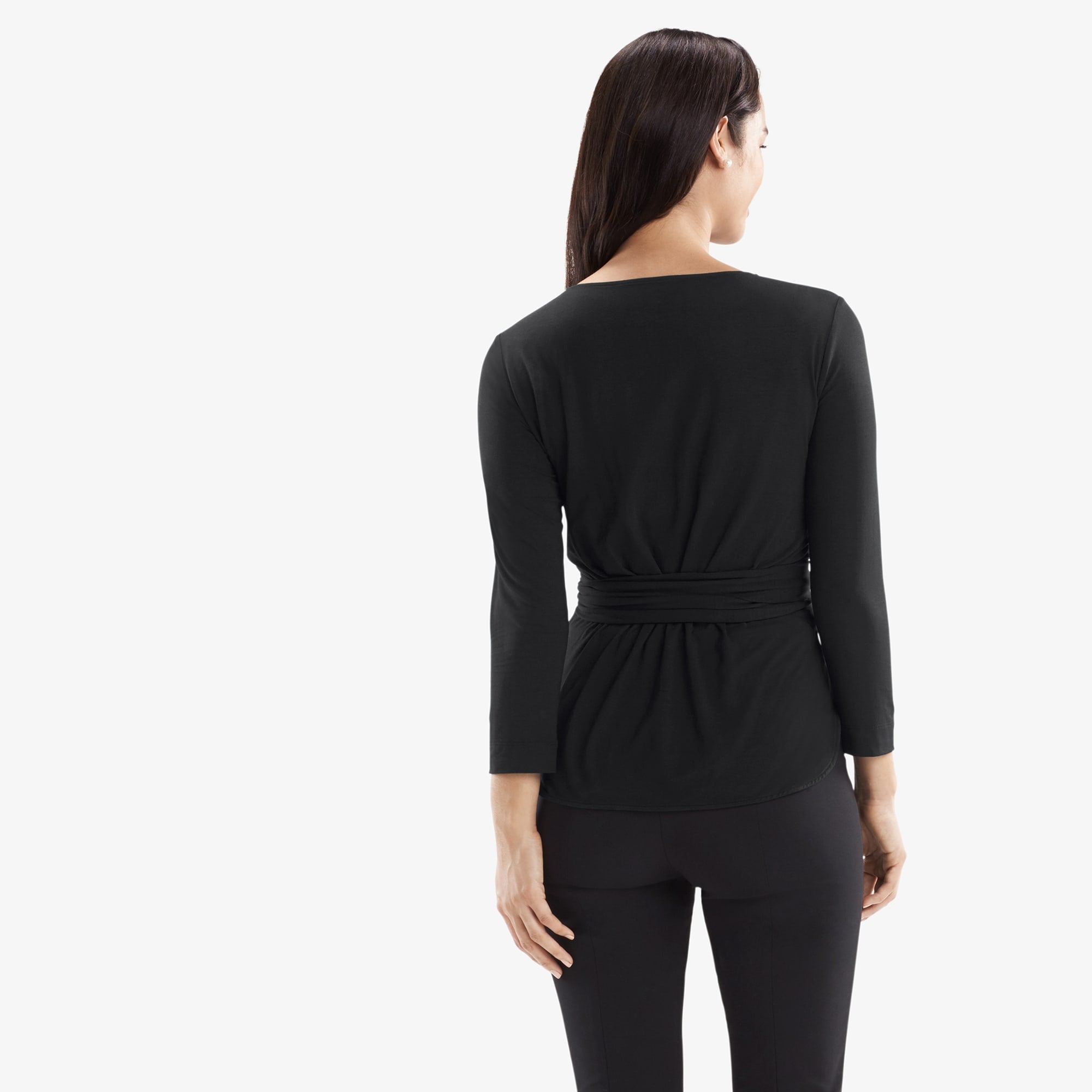 Back image of a woman standing wearing the Walker top knit crepe in Black
