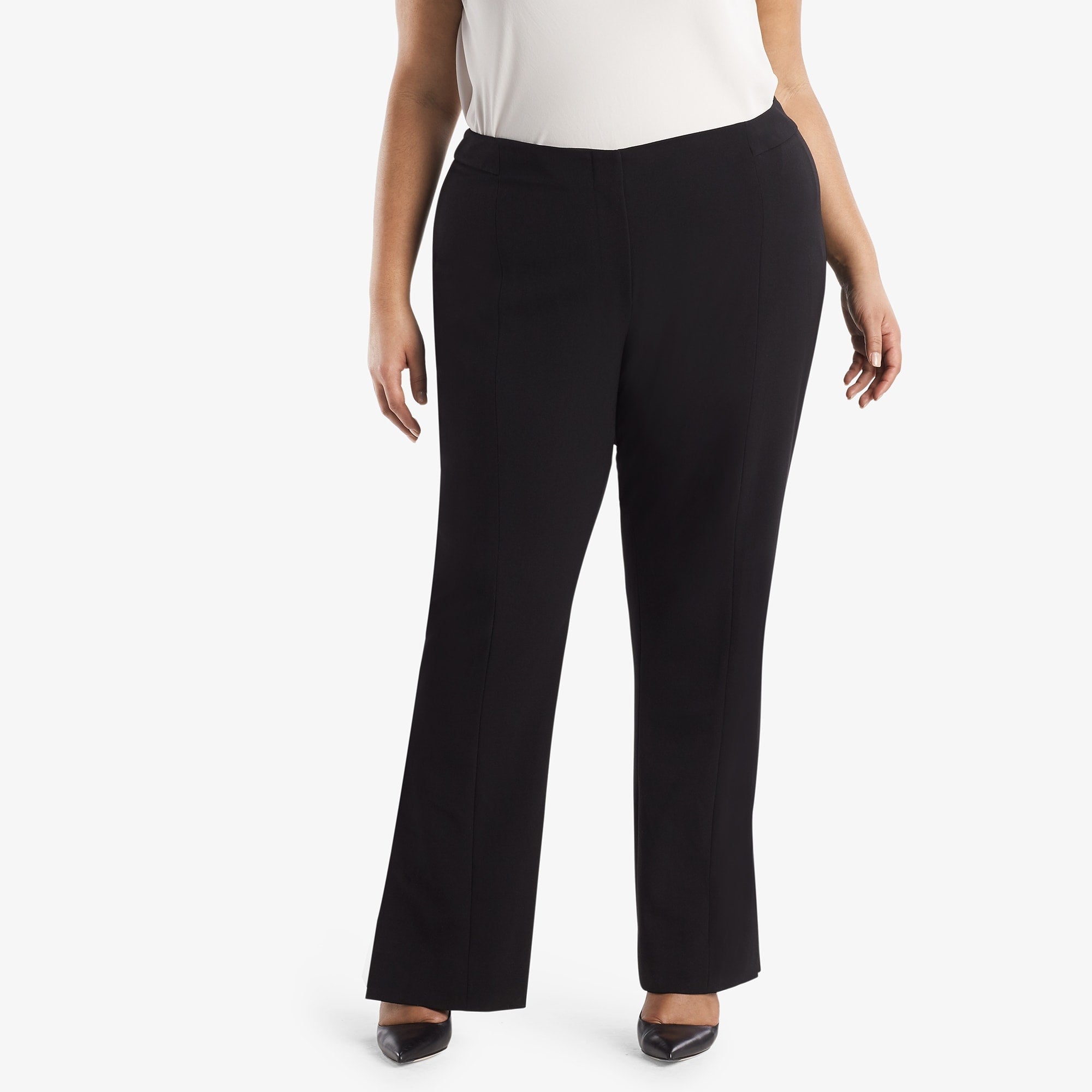 Front image of a woman standing wearing the Mercado Pant in black