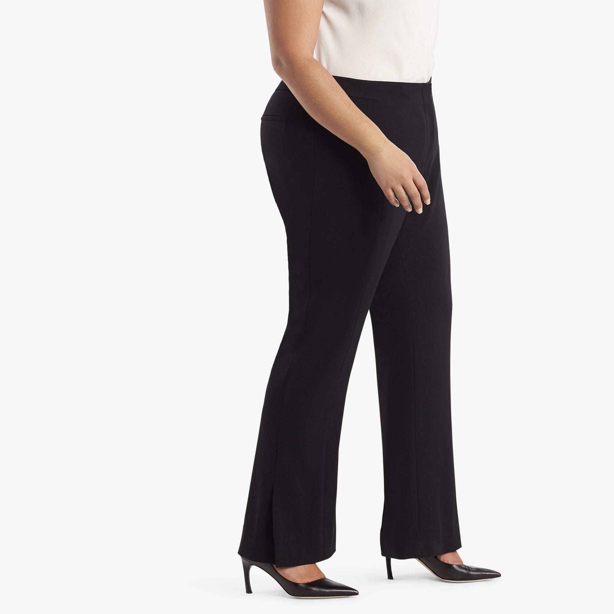 Side image of a woman standing wearing the Mercado Pant in black