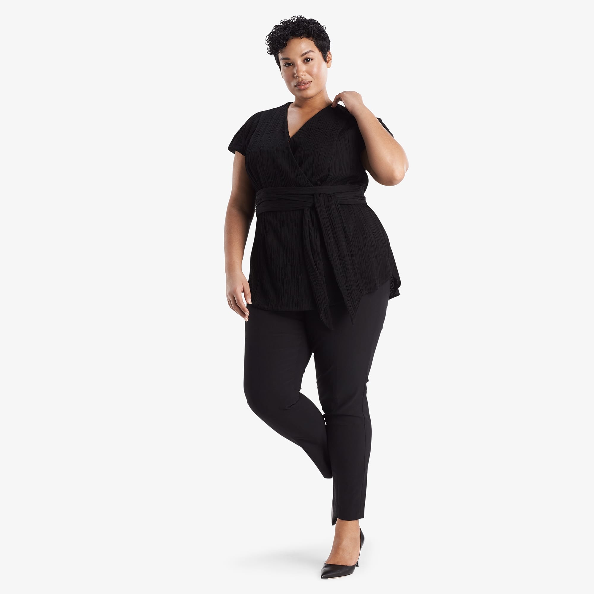 Front image of a woman standing wearing the Valerie Top in black
