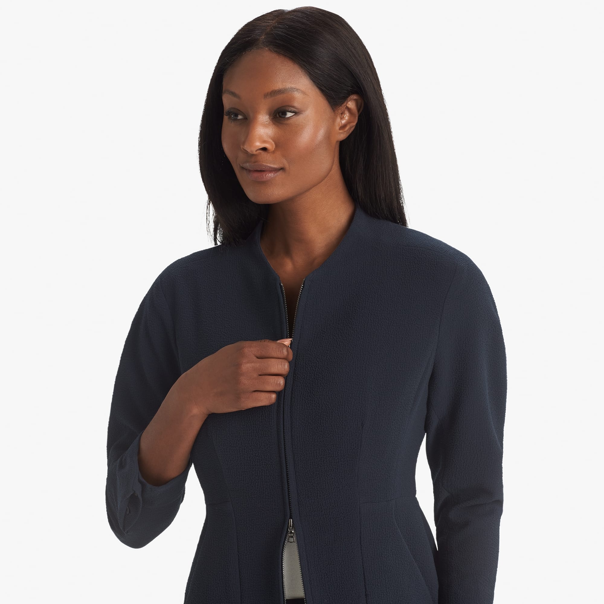 Detail image of a woman standing wearing the Higgins jacket staccato in galaxy blue