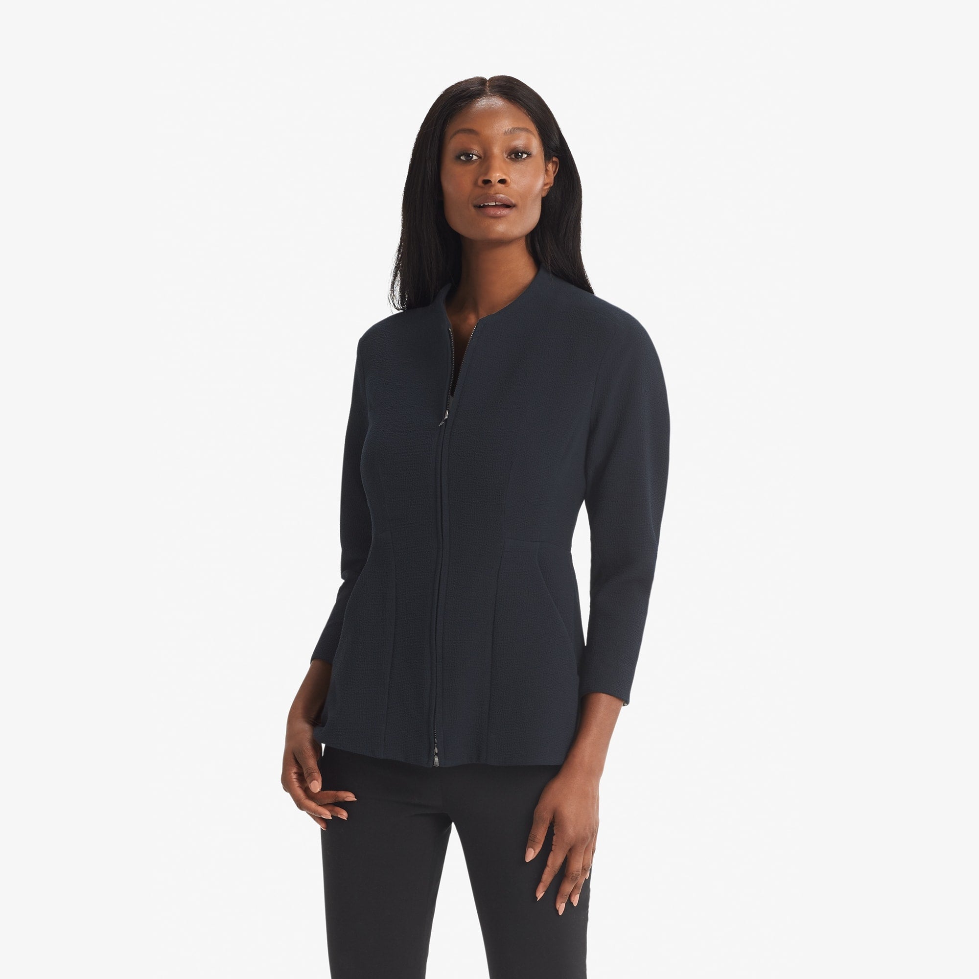 Front image of a woman standing wearing the Higgins jacket staccato in galaxy blue 