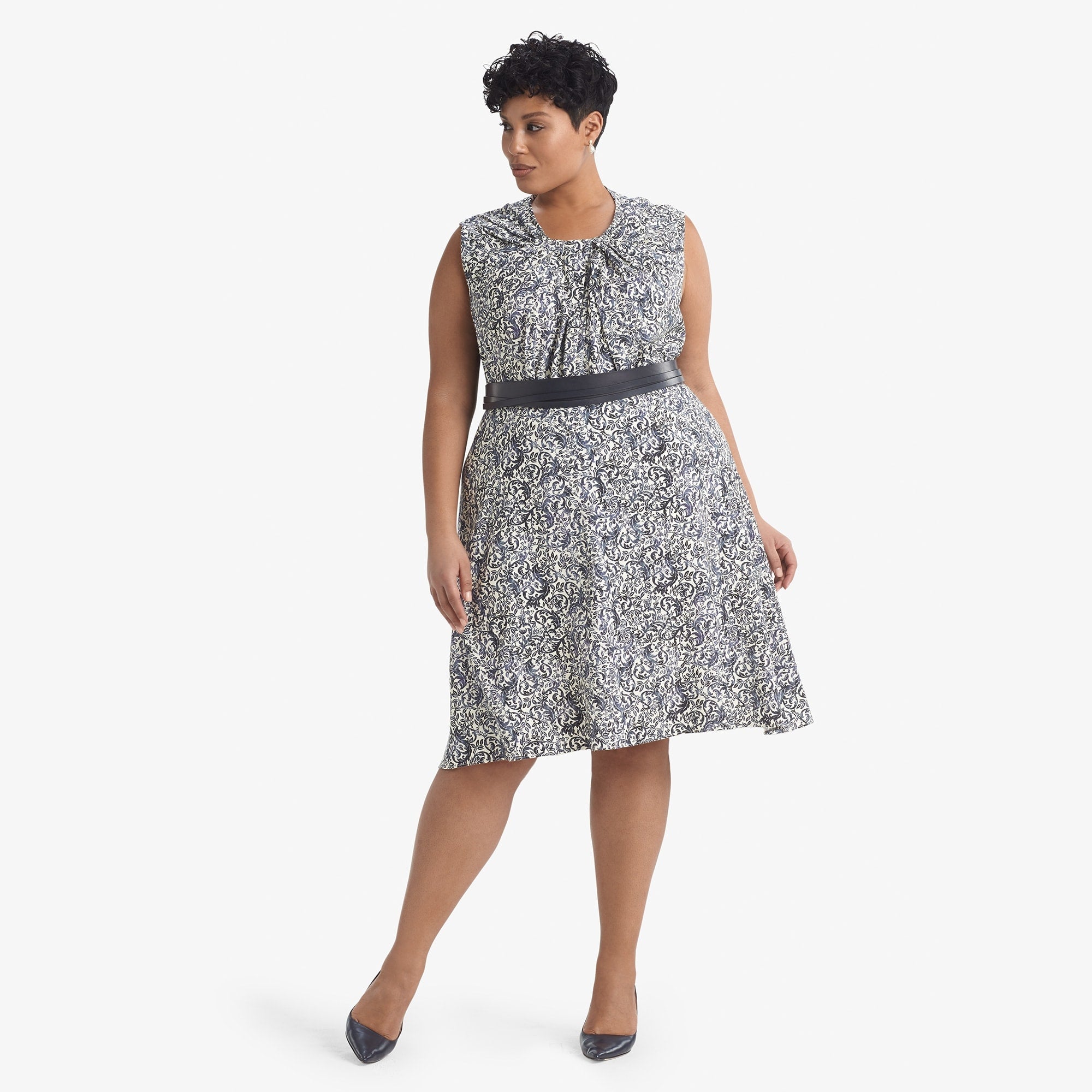 Front image of a woman standing wearing the Hopson skirt Ivy Print in galaxy blue 