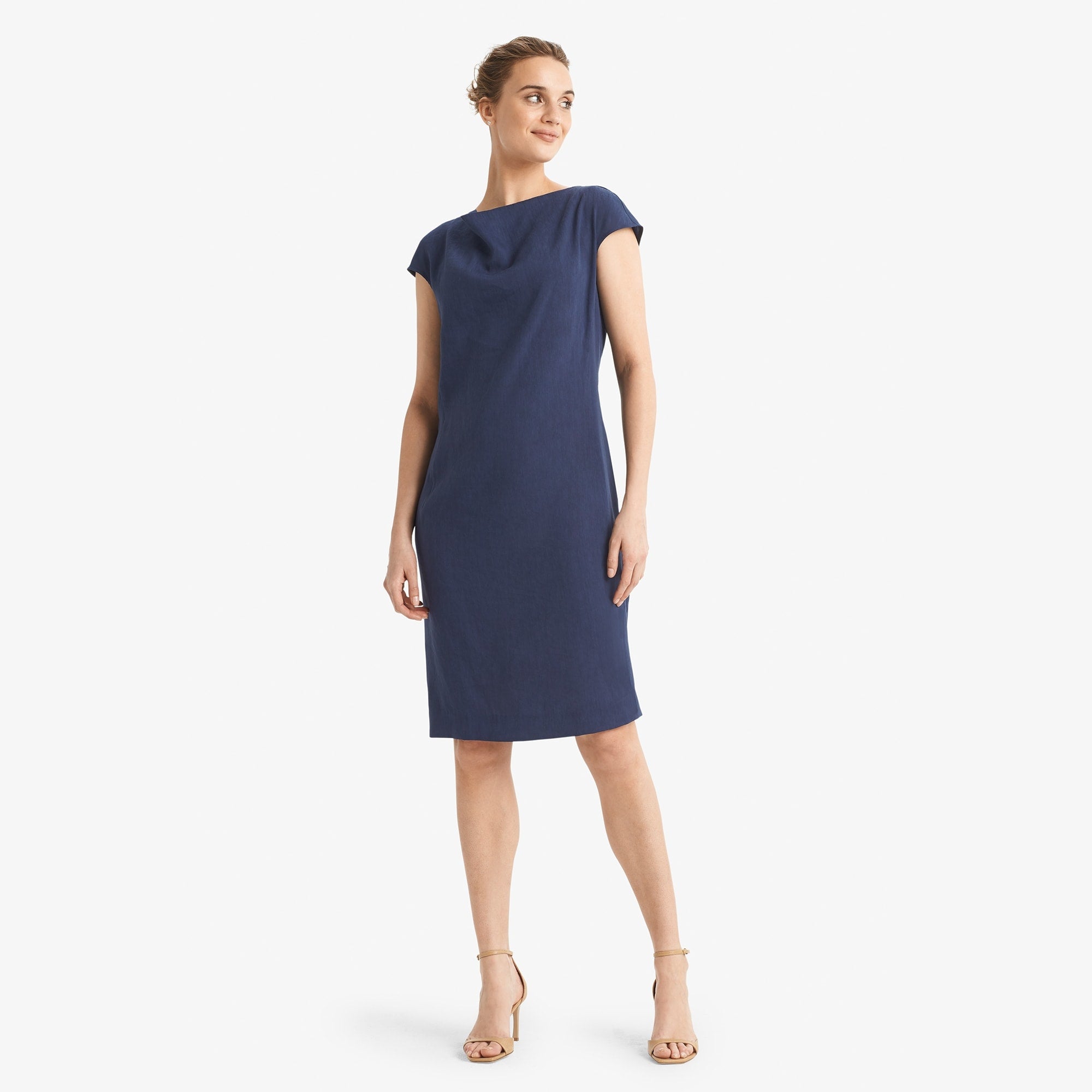 Front image of a woman standing wearing the Marilyn dress stretch linen in blueberry 
