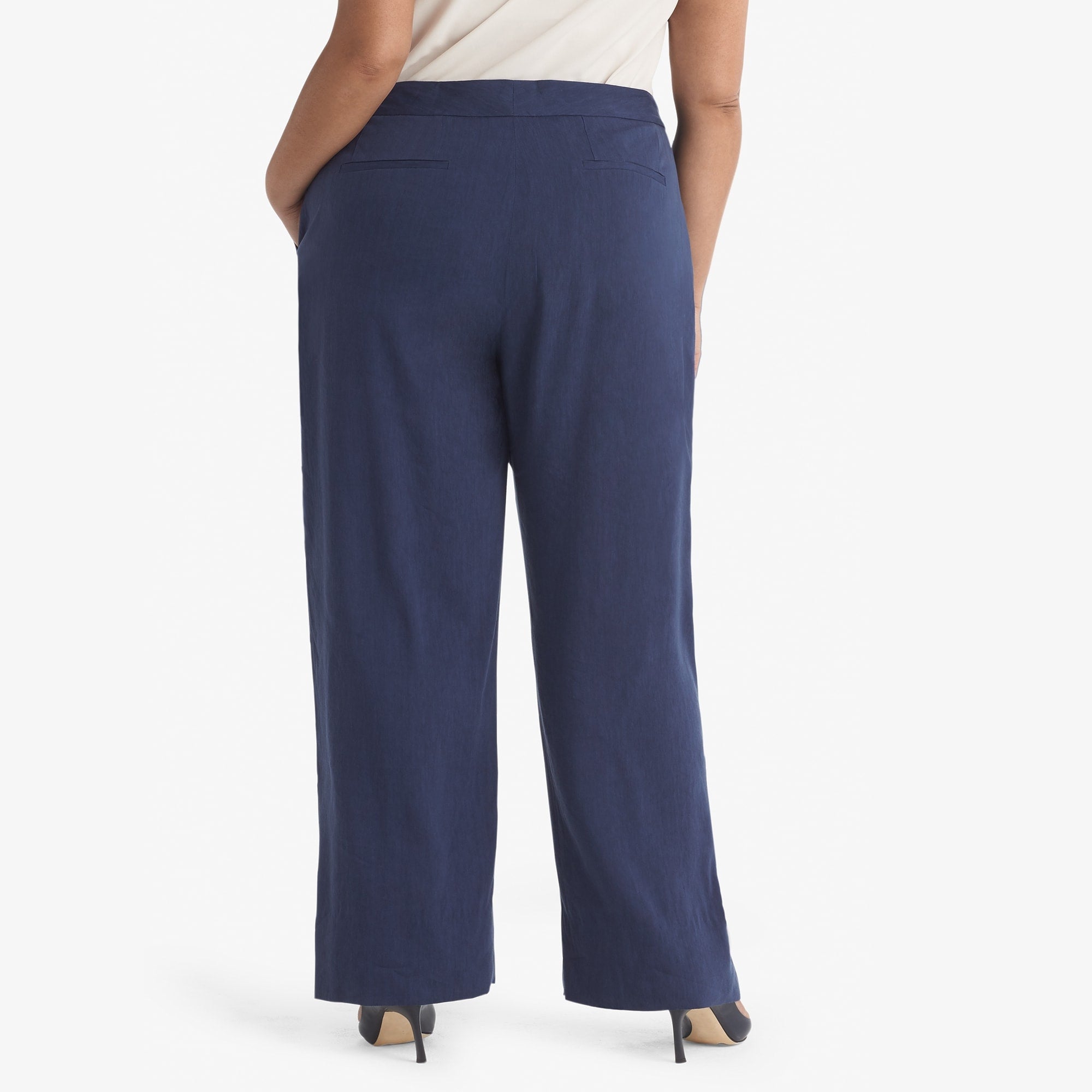 Back image of a woman standing wearing the Tinsley trouser stretch linen in blueberry