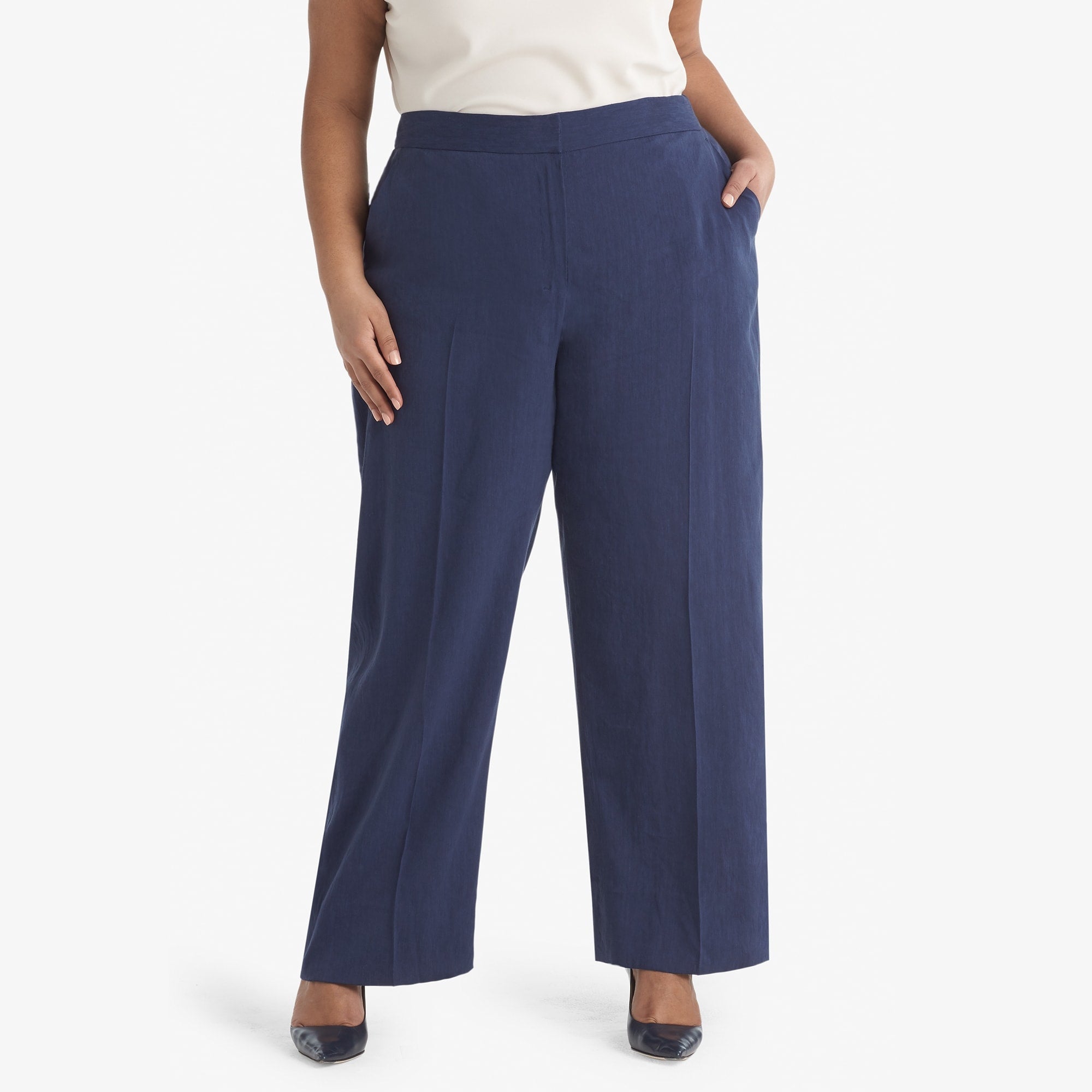 Front image of a woman standing wearing the Tinsley trouser stretch linen in blueberry 