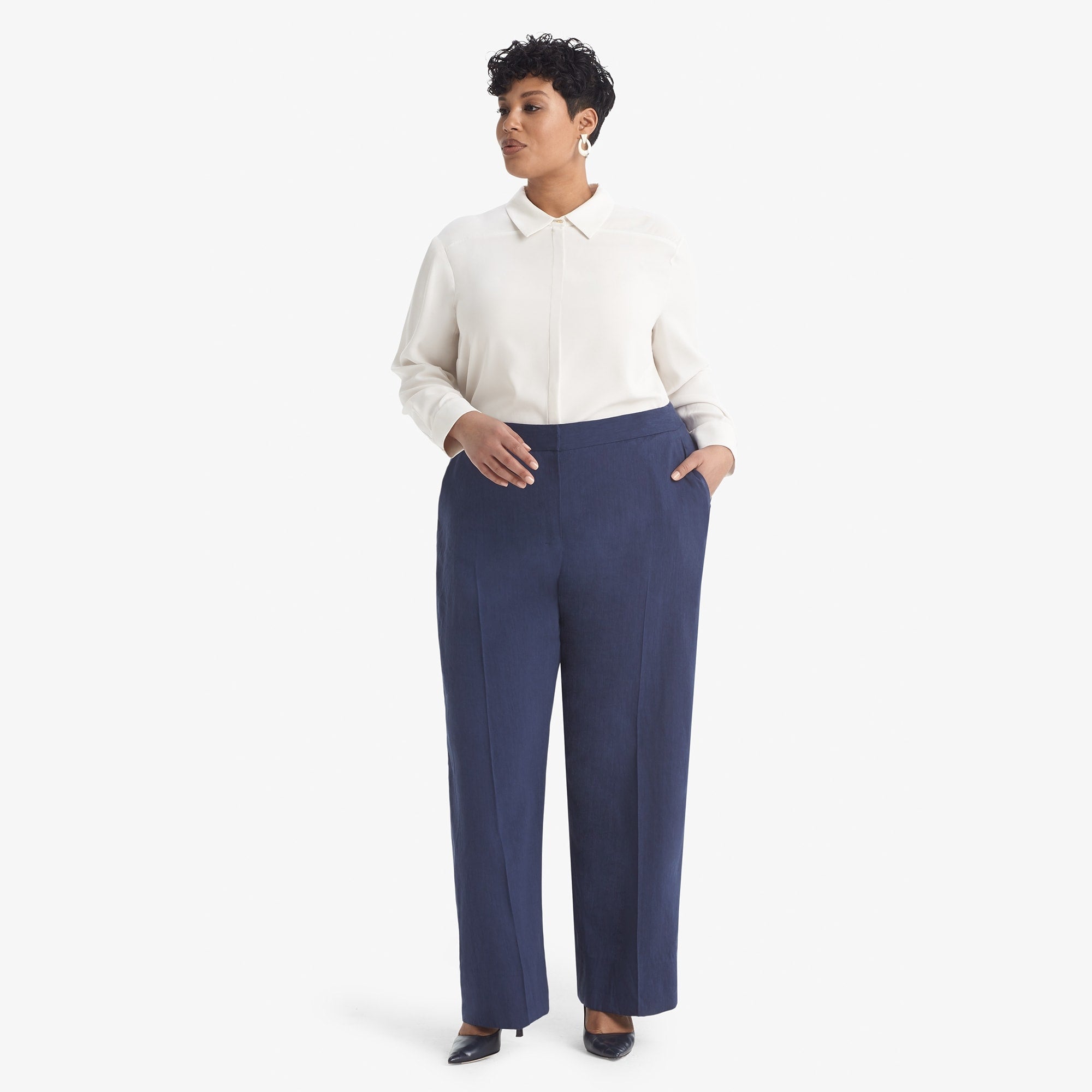 Front image of a woman standing wearing the Tinsley trouser stretch linen in blueberry