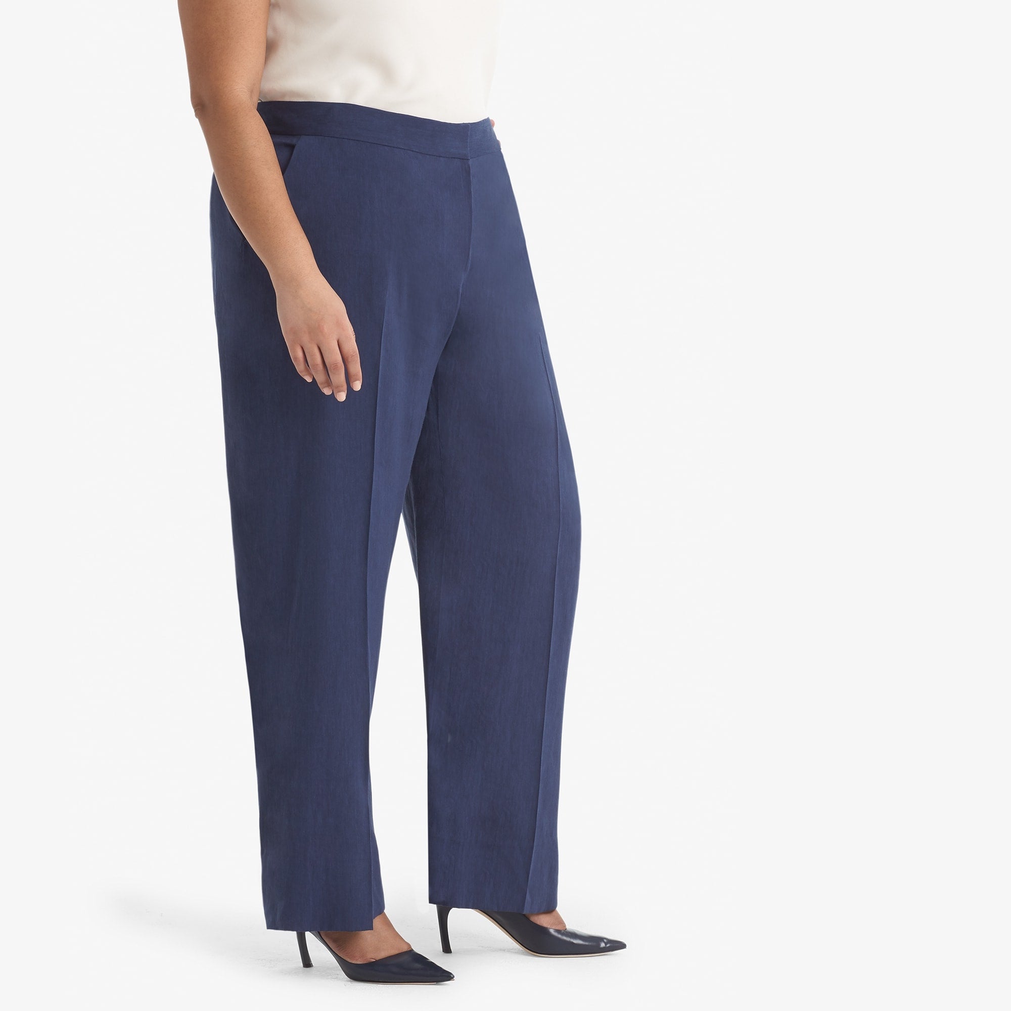 Side image of a woman standing wearing the Tinsley trouser stretch linen in blueberry