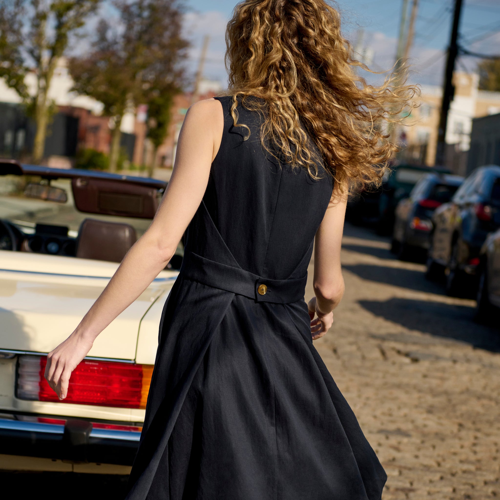 Back image of a woman wearing the Estela Dress in Night