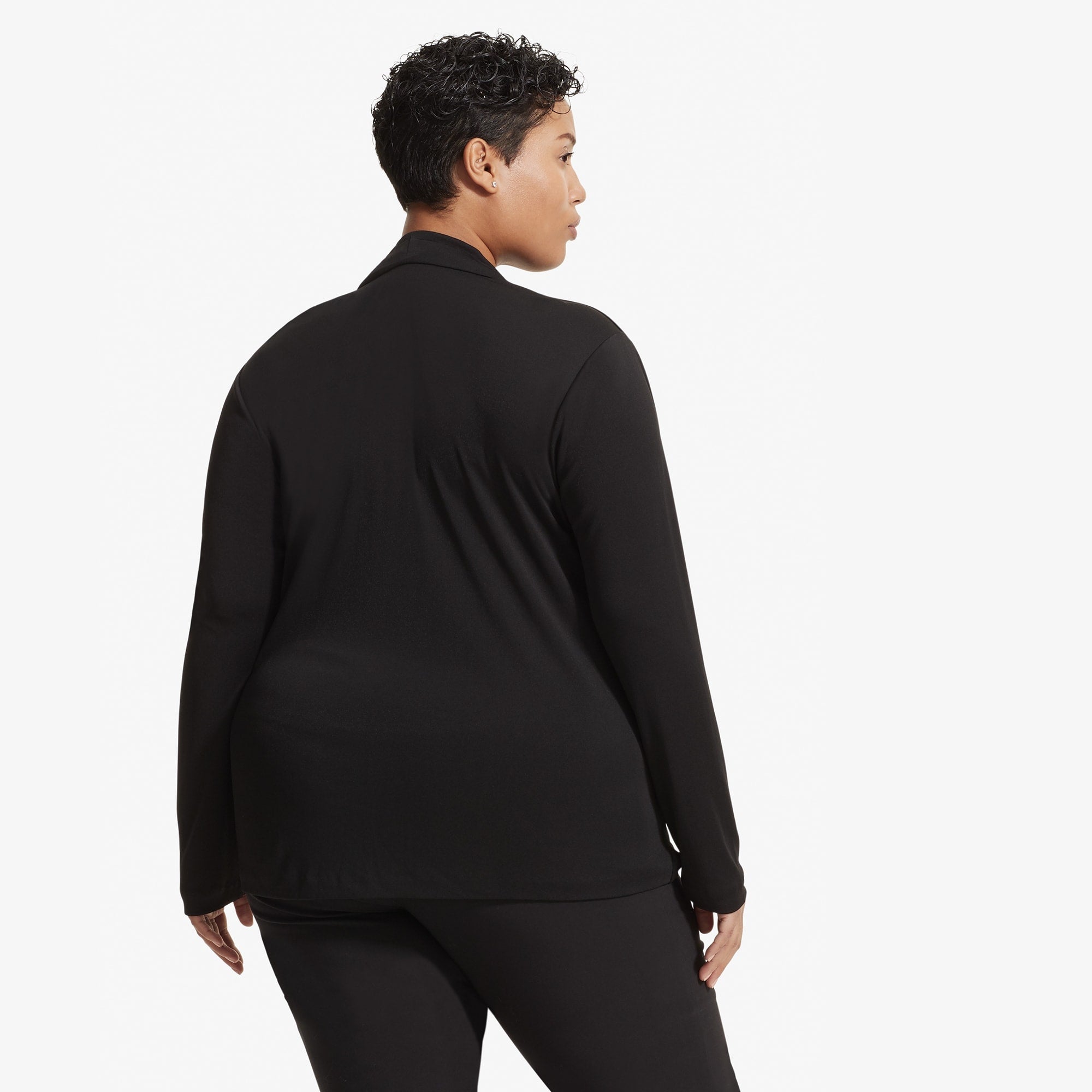 Back image of a woman standing wearing the Alma top in Black