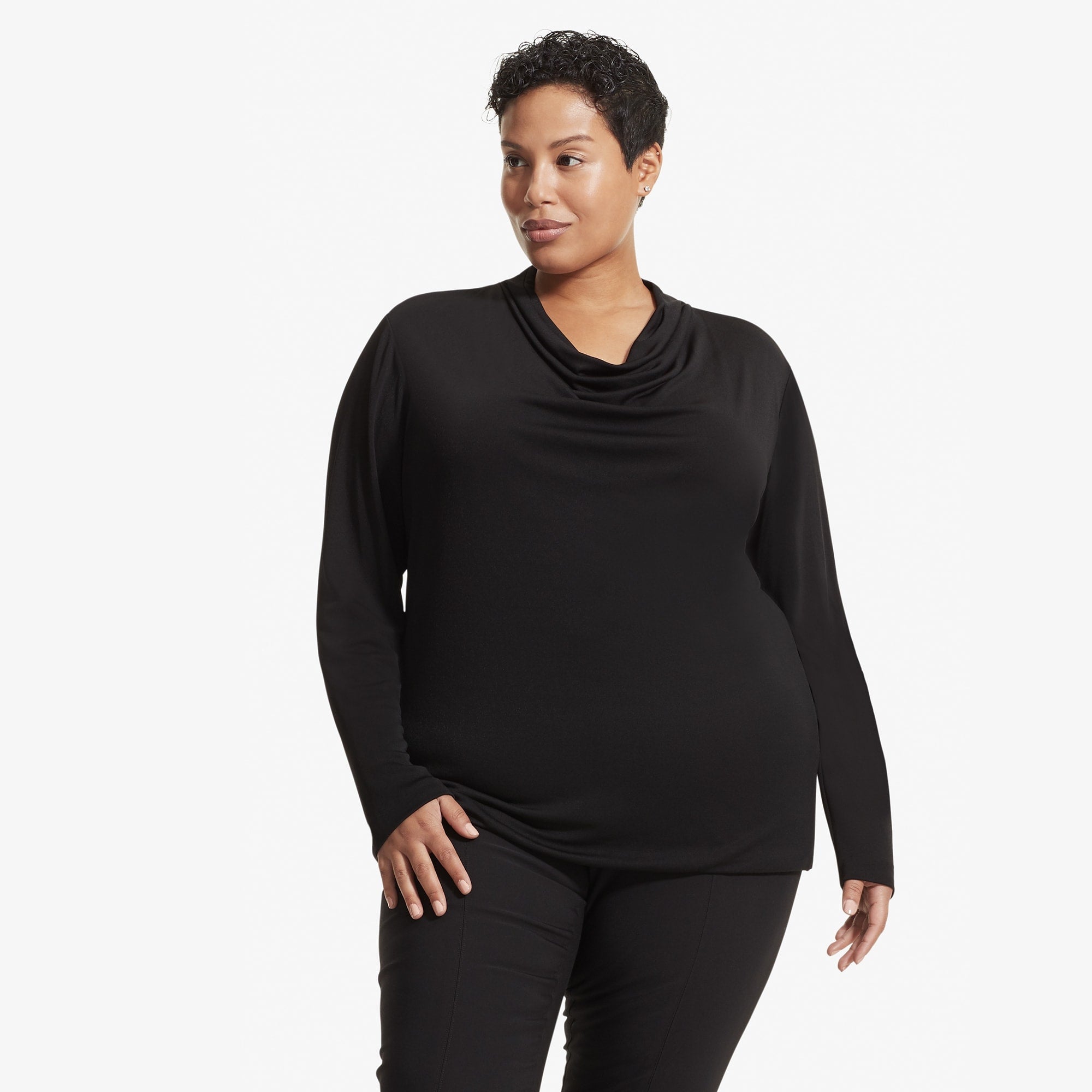 Front image of a woman standing wearing the Alma top in Black 