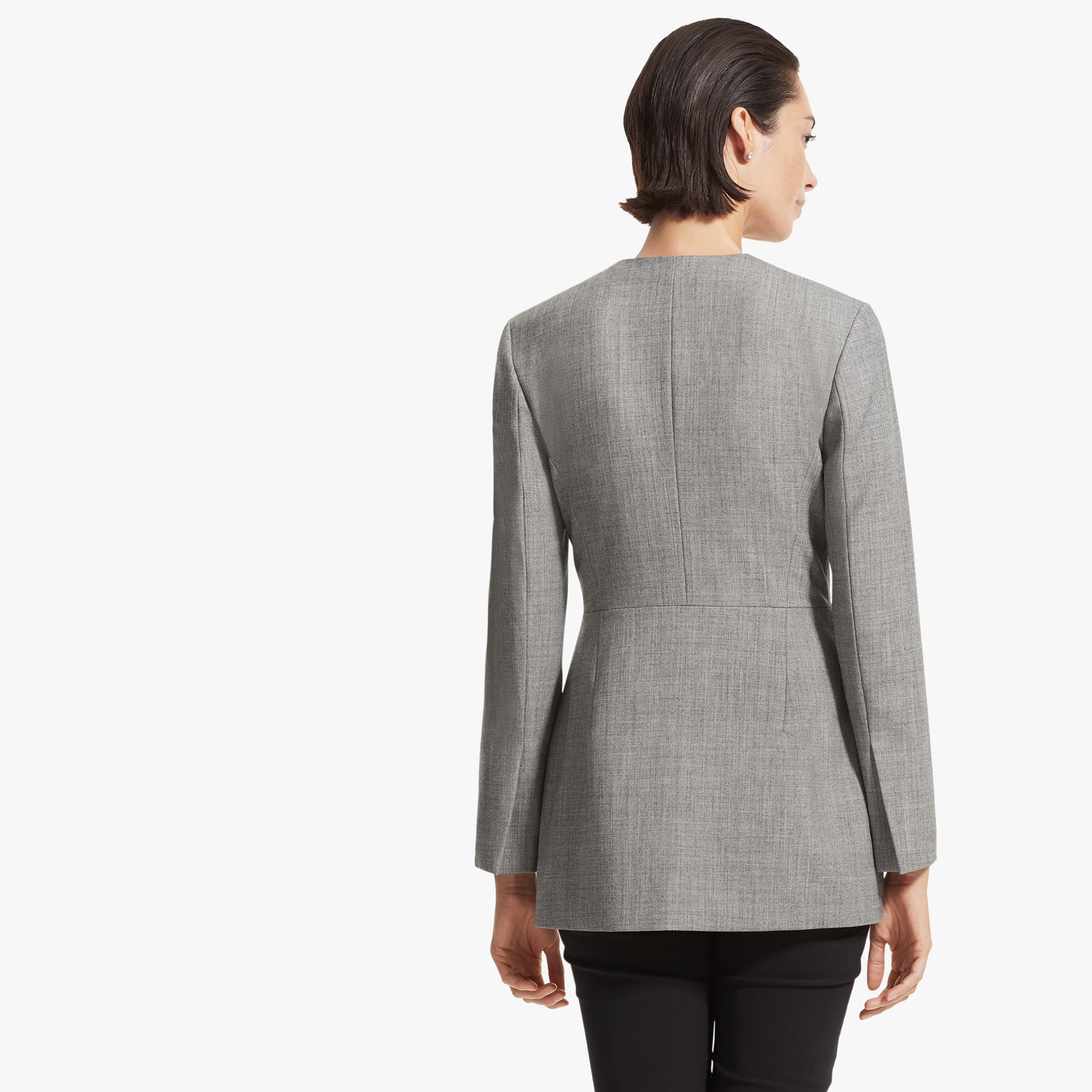 Back image of a woman standing wearing the Carmen jacket sharkskin in Black and white