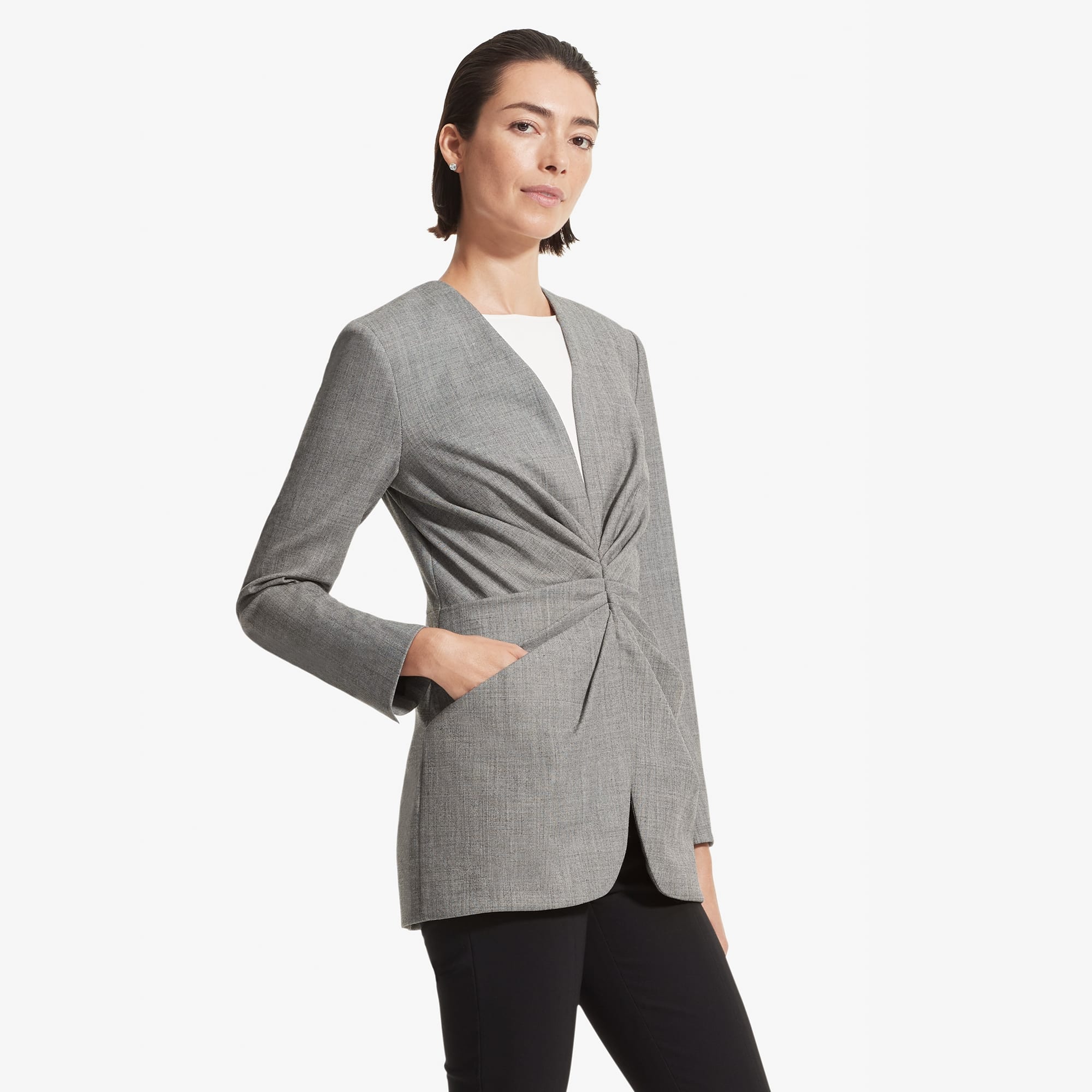 Side image of a woman standing wearing the Carmen jacket sharkskin in Black and white