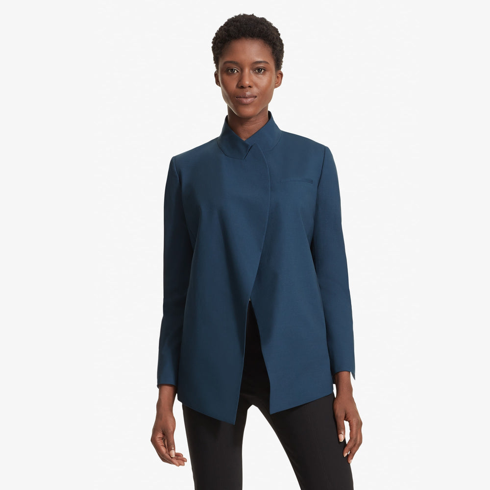 Front image of a woman standing wearing the Oliver jacket in Twilight