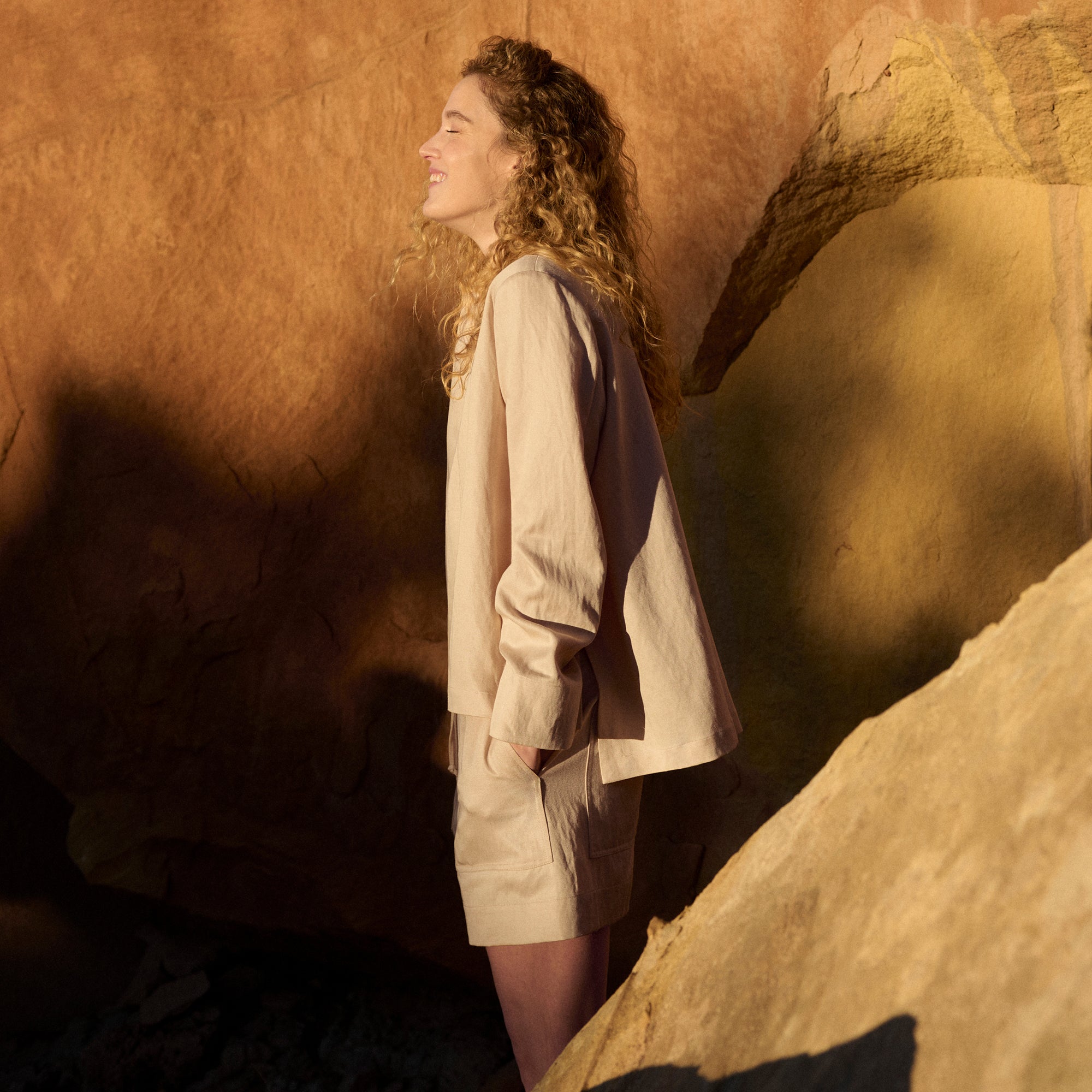 Side image of a woman wearing the Annette Top - Everyday Twill in Butter