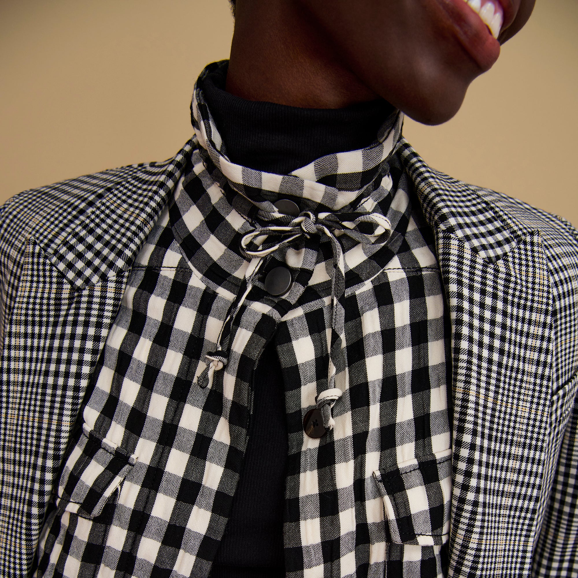 Detail image of a woman wearing the Allison Anorak - Luxe Gingham in black / white