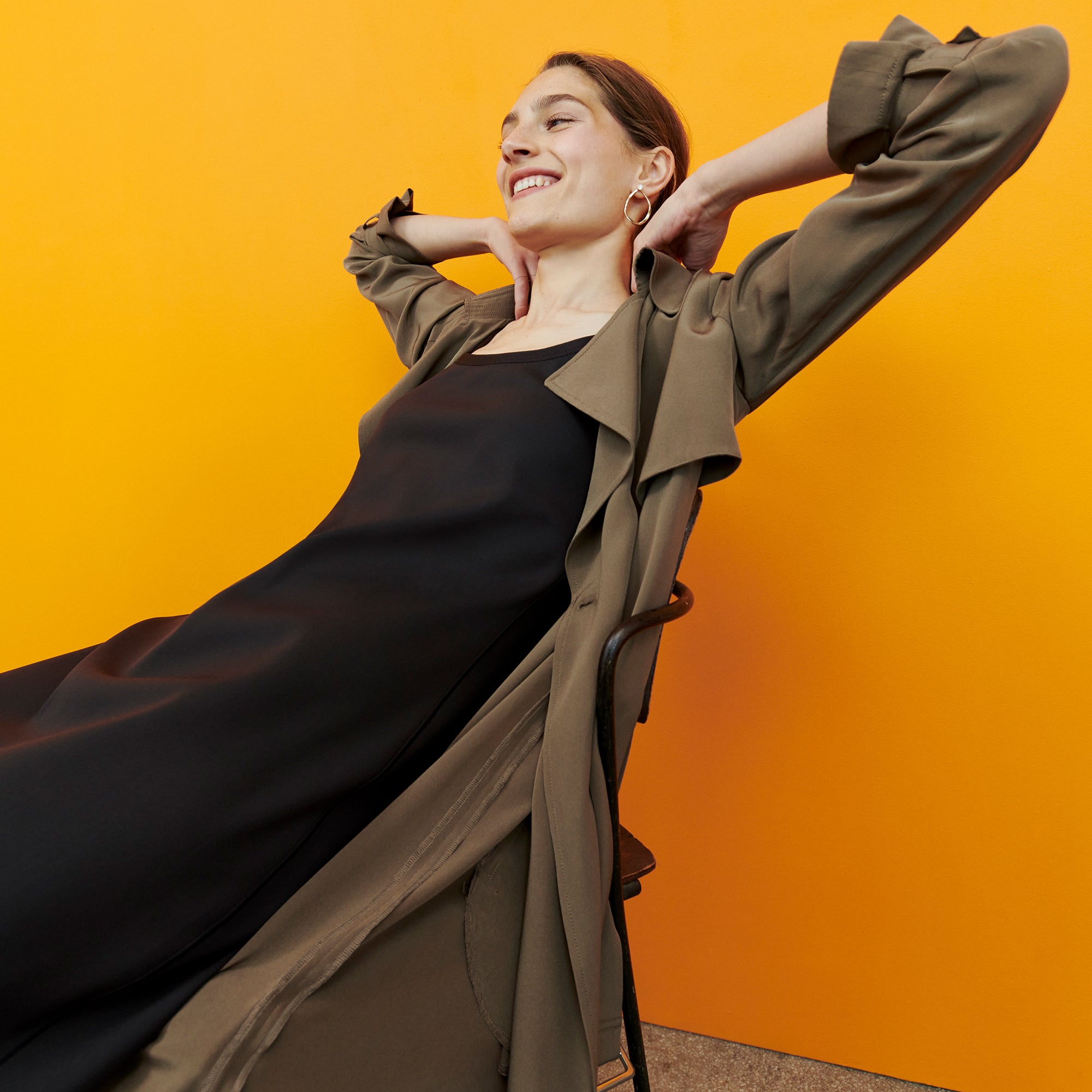 Side image of a woman wearing the Jensen Trench - Silk in Deep Khaki