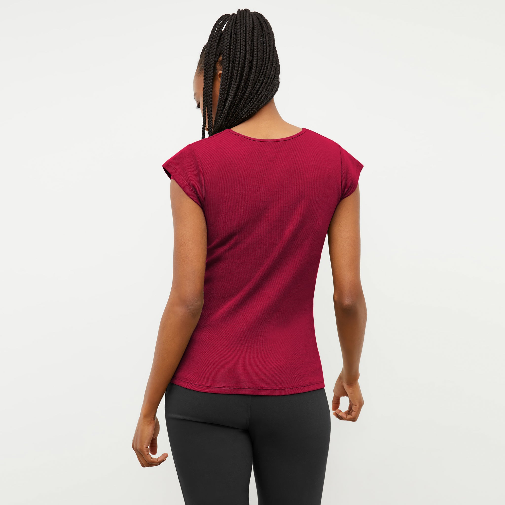 back image of a woman wearing the mori henley in fuchsia