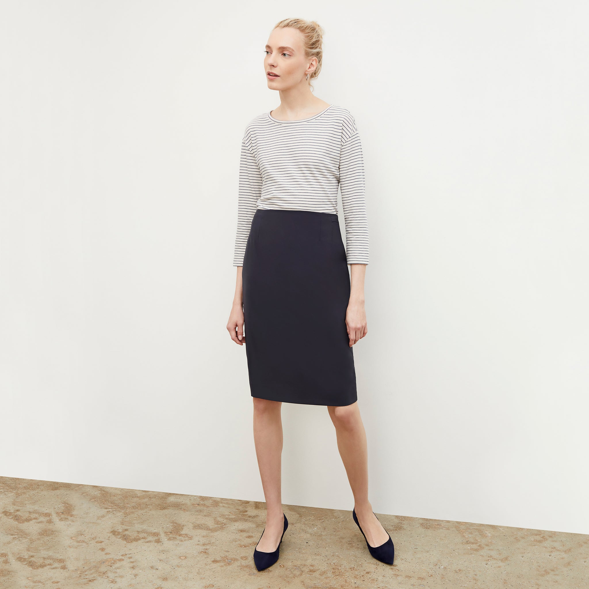 Front image of a woman wearing the Cobble Hill Skirt - OrigamiTech in Cool Charcoal