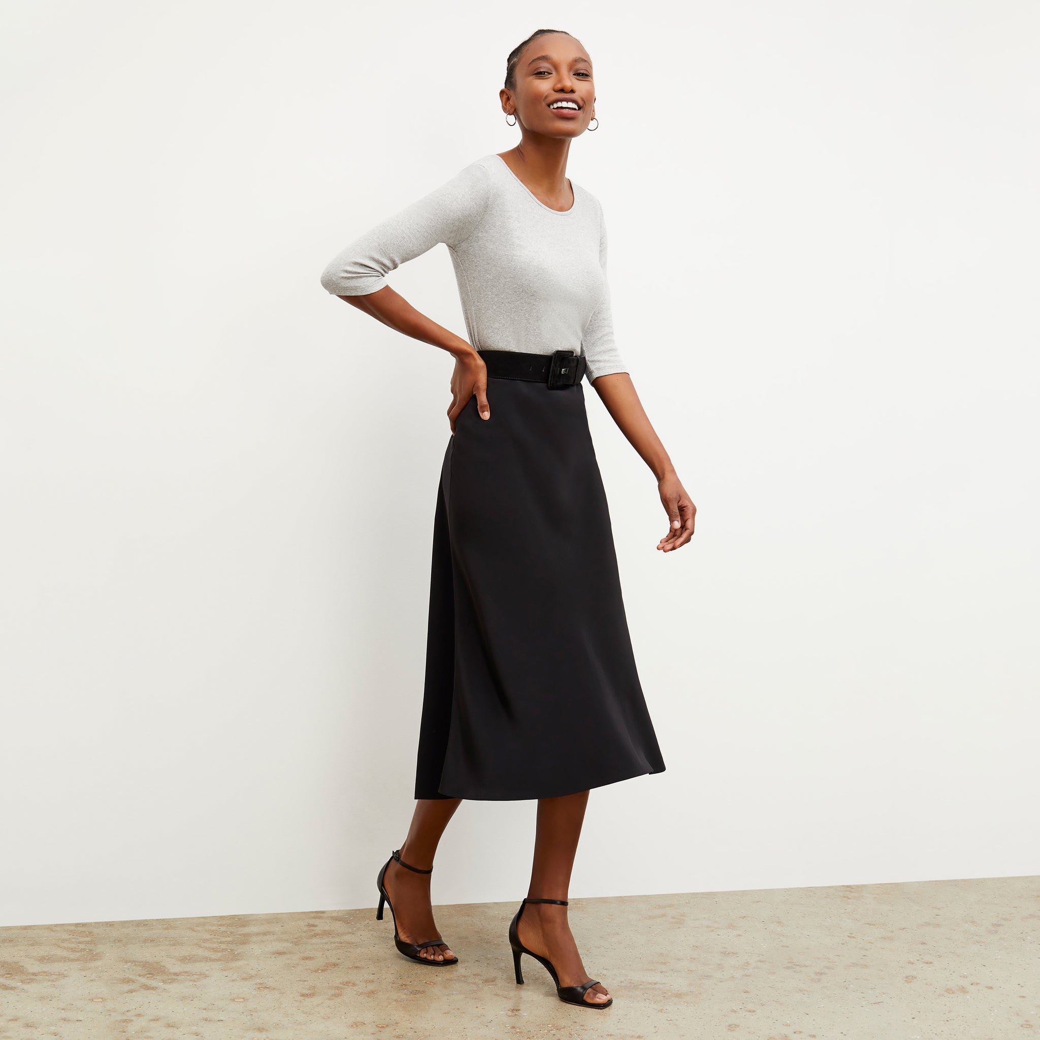Side image of a woman wearing the Orchard Skirt - Washable Silk in Black 