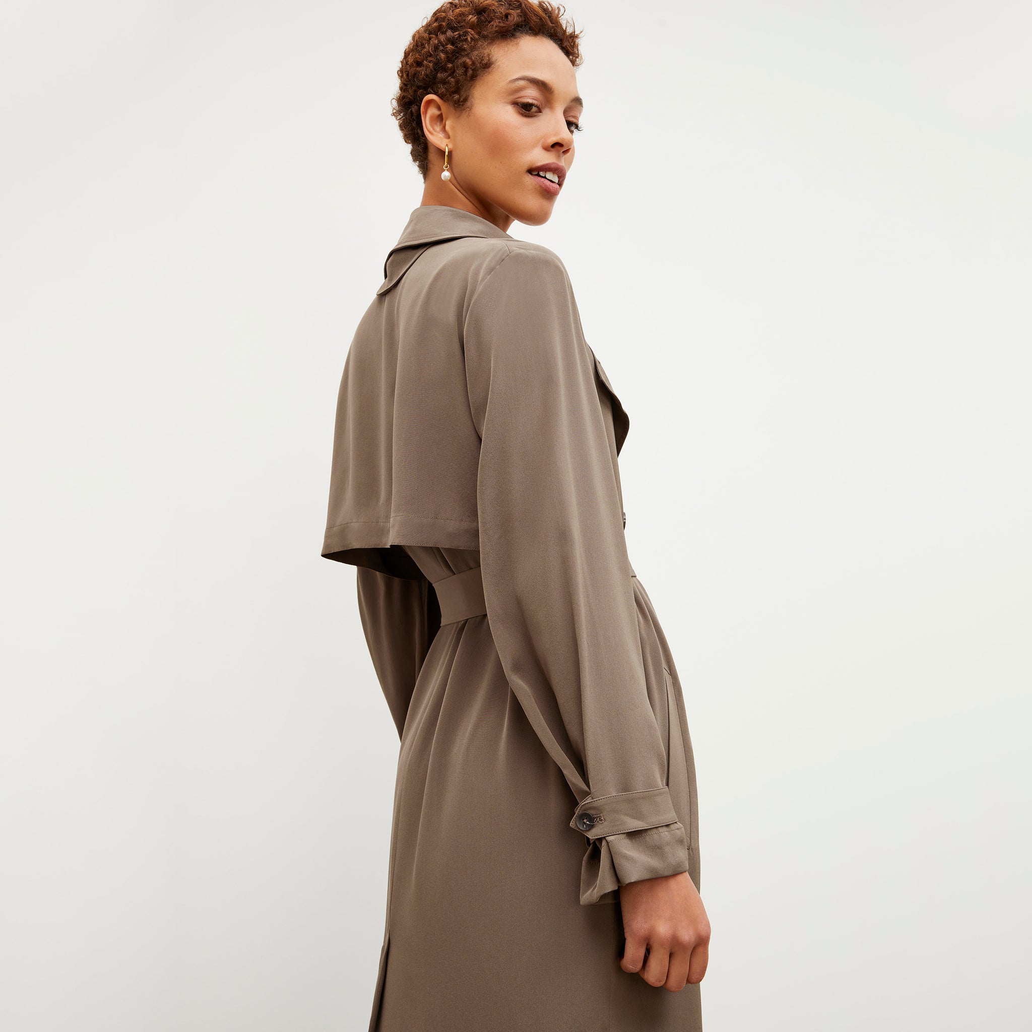 Back image of a woman wearing the Jensen Trench - Silk in Deep Khaki