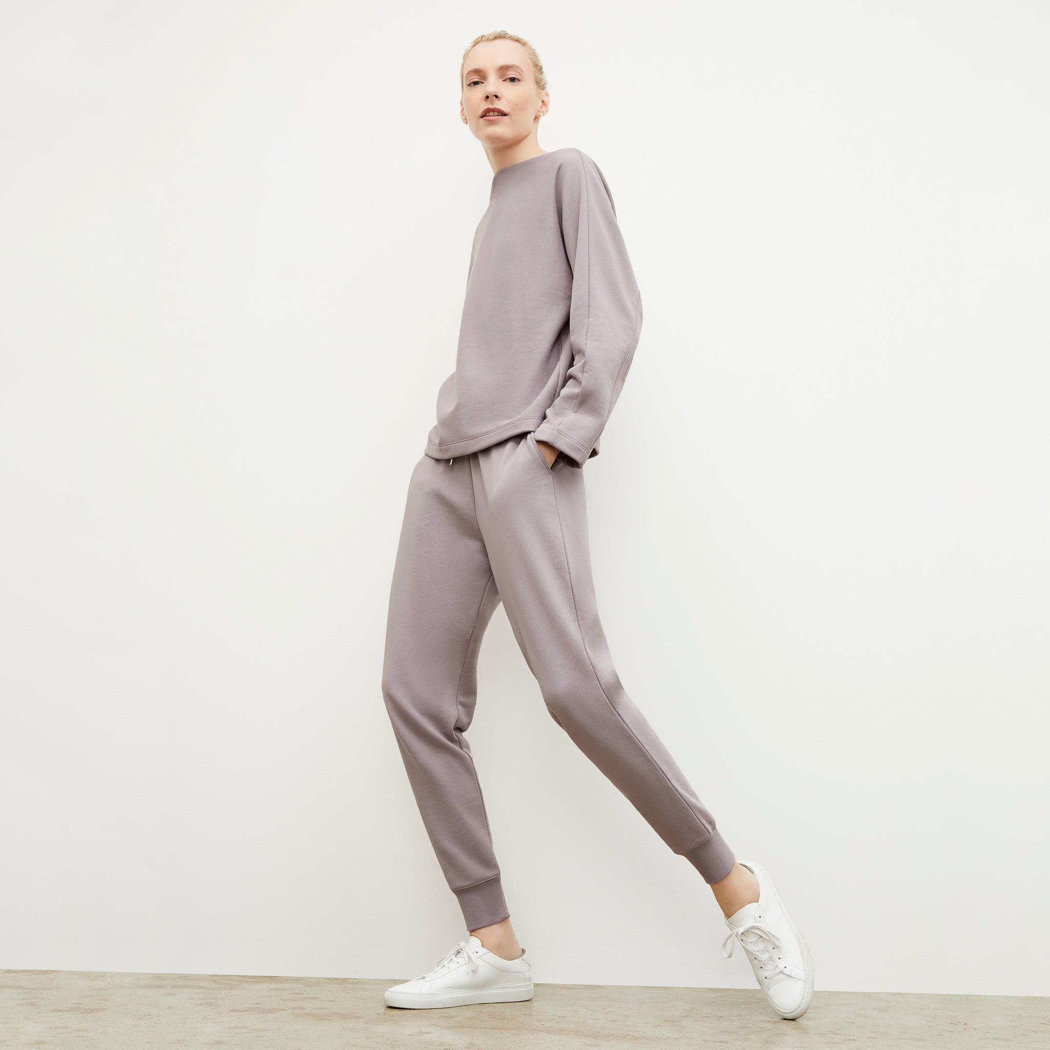 Side image of a woman wearing the Joni Jogger - French Terry in Wisteria 