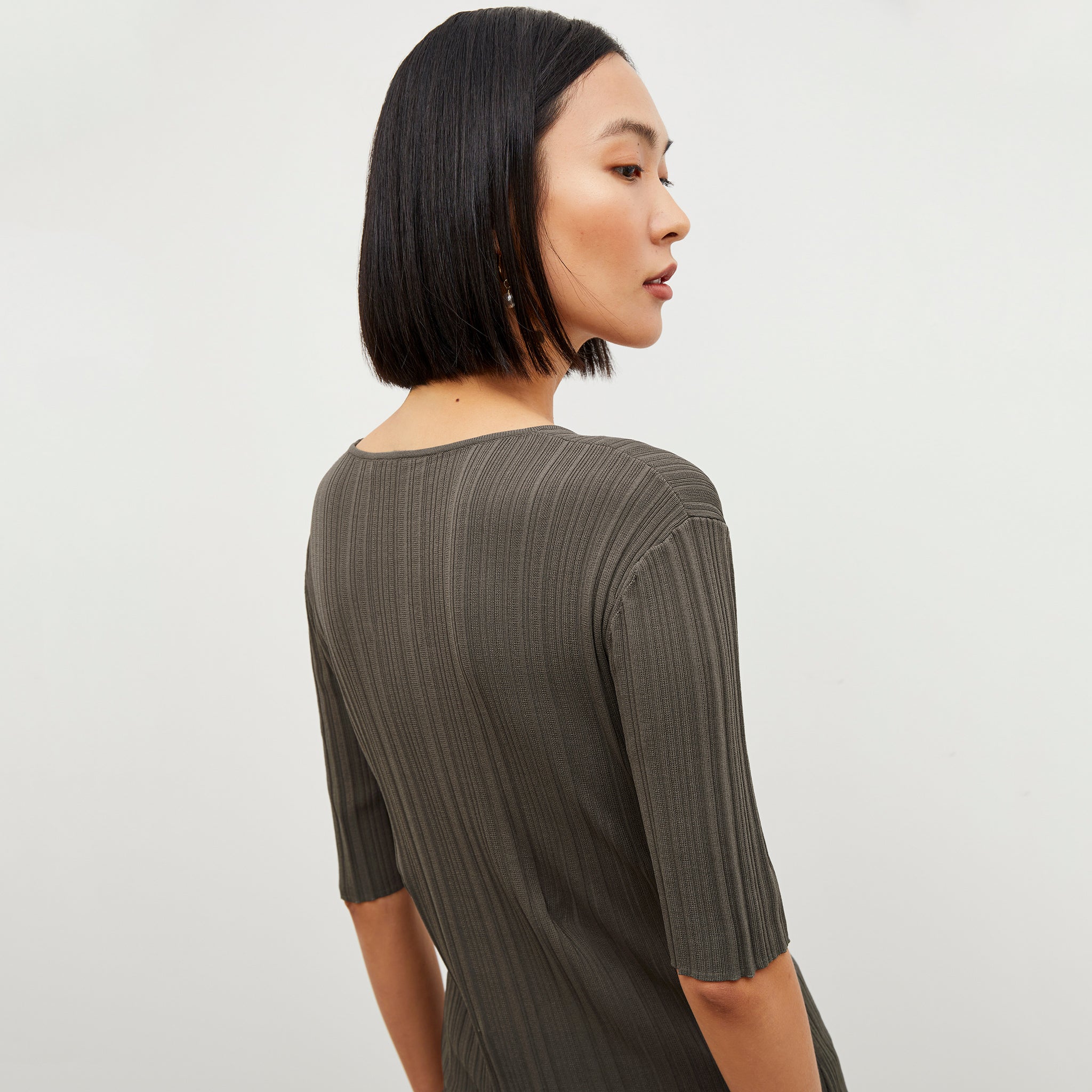 Back image of a woman wearing the Charli Top - Textured Knit in Light Ash