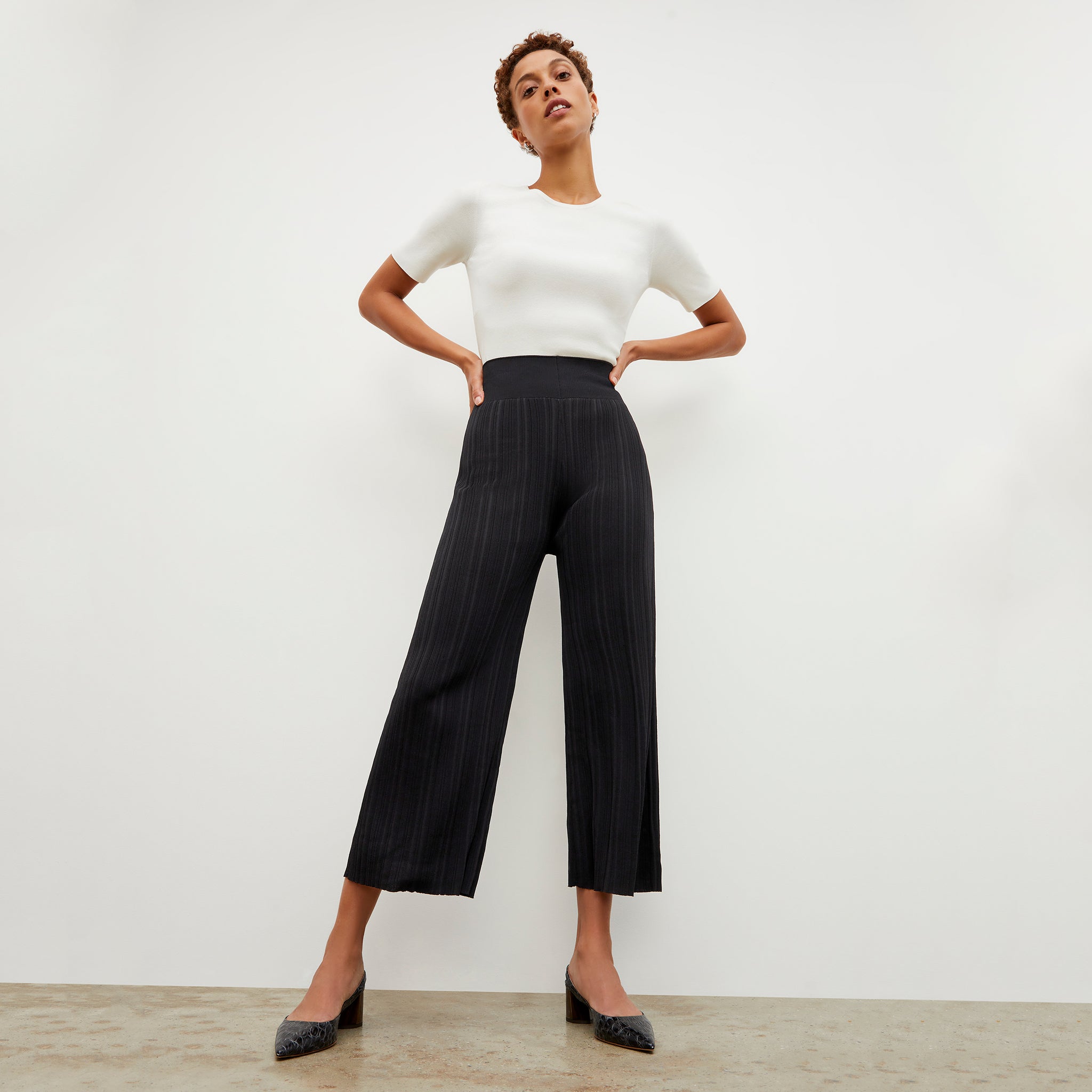 Front image of a woman wearing the Marijane Pant - Textured Knit in Black 