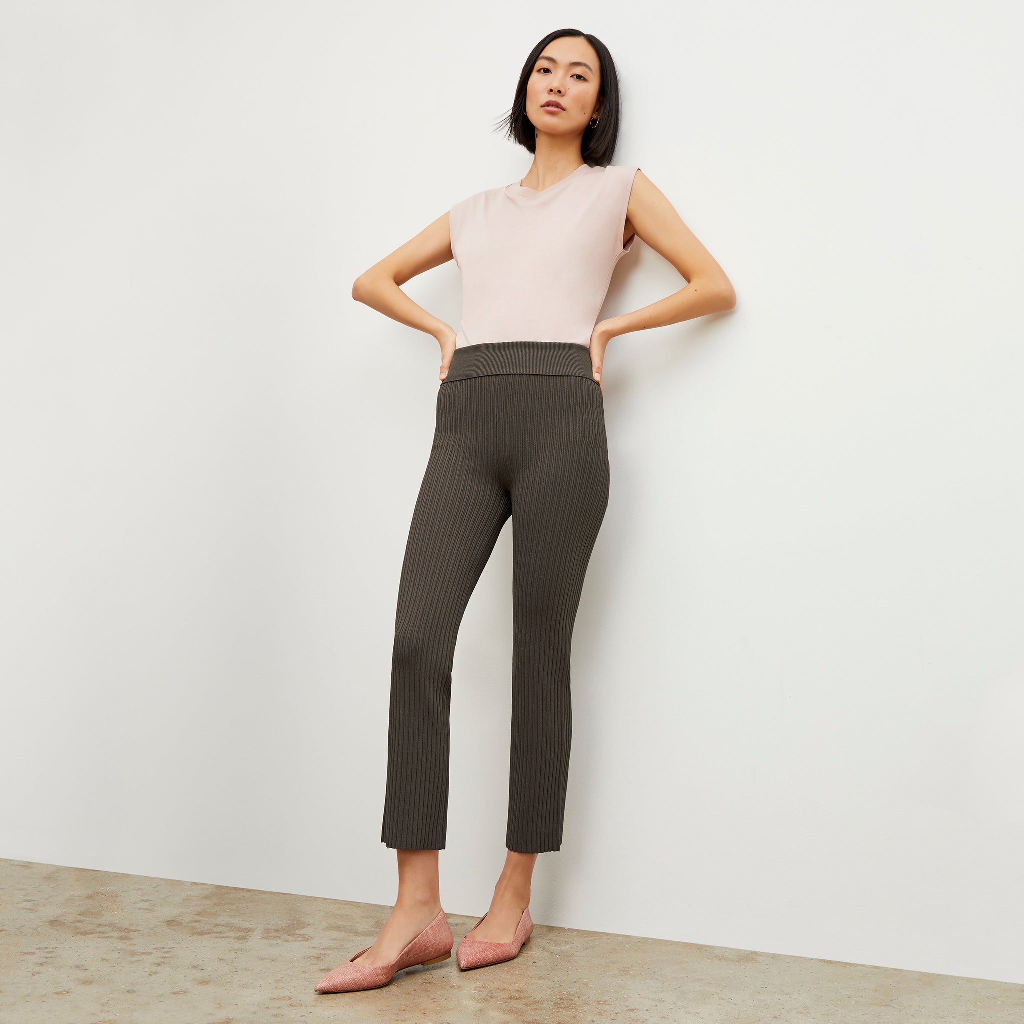 Front image of a woman standing wearing the Alina T-Shirt—Compact Cotton in Dusty Pink