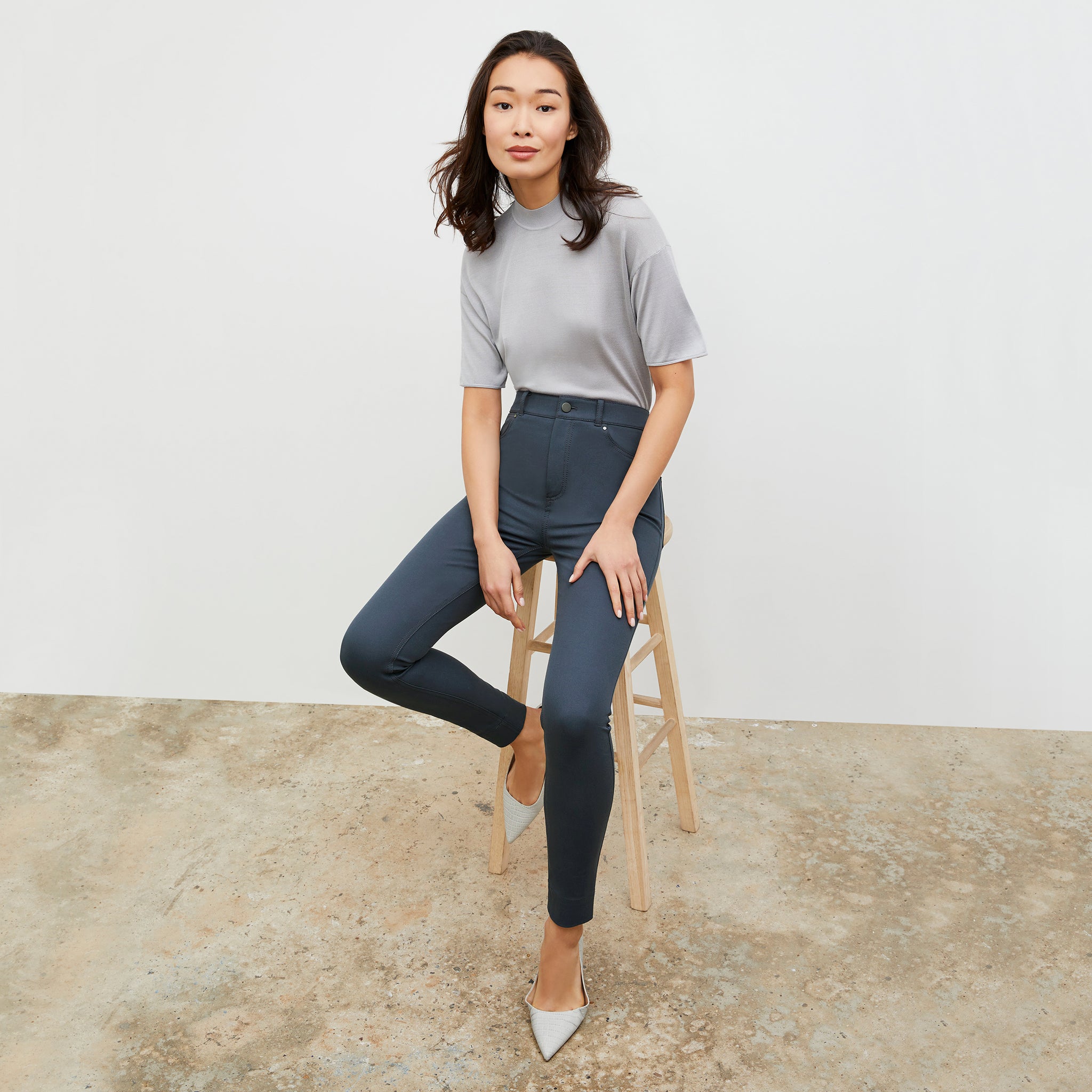 Front image of a woman wearing the Mia Top in Pale Gray