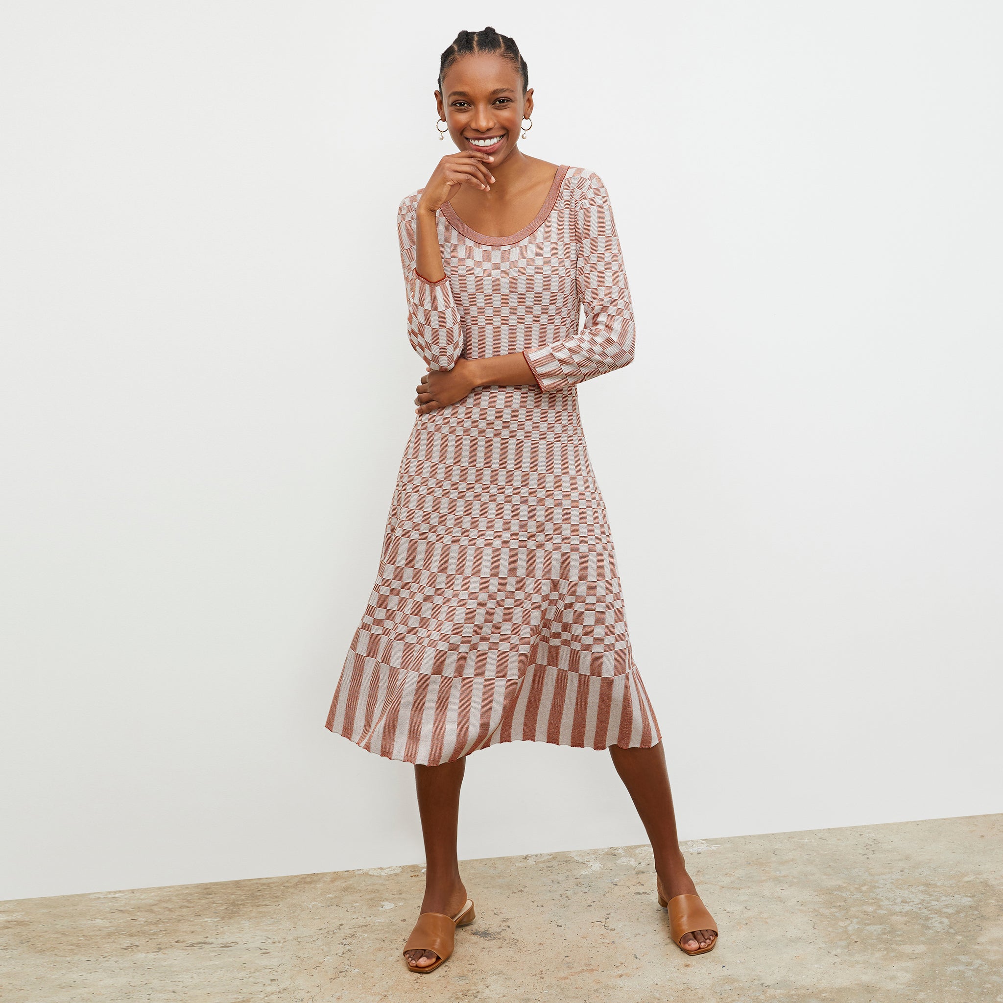 Front image of a woman wearing the Tippy Dress - Checkered Knit in Red Clay / Natural 