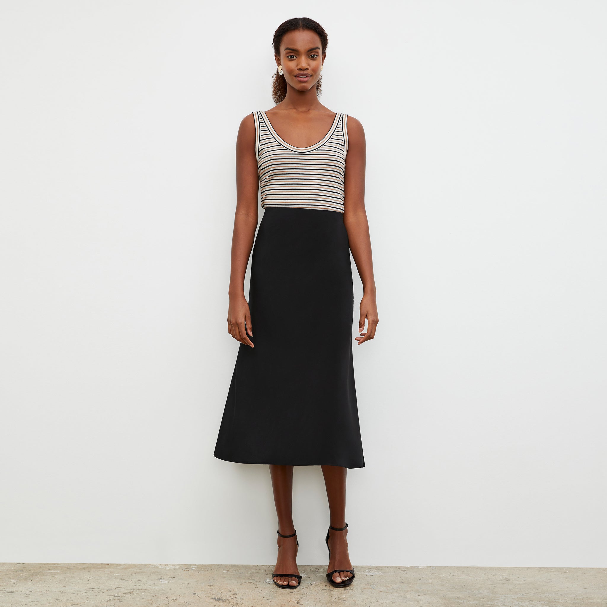 Front image of a woman wearing the Orchard Skirt - Washable Silk in Black
