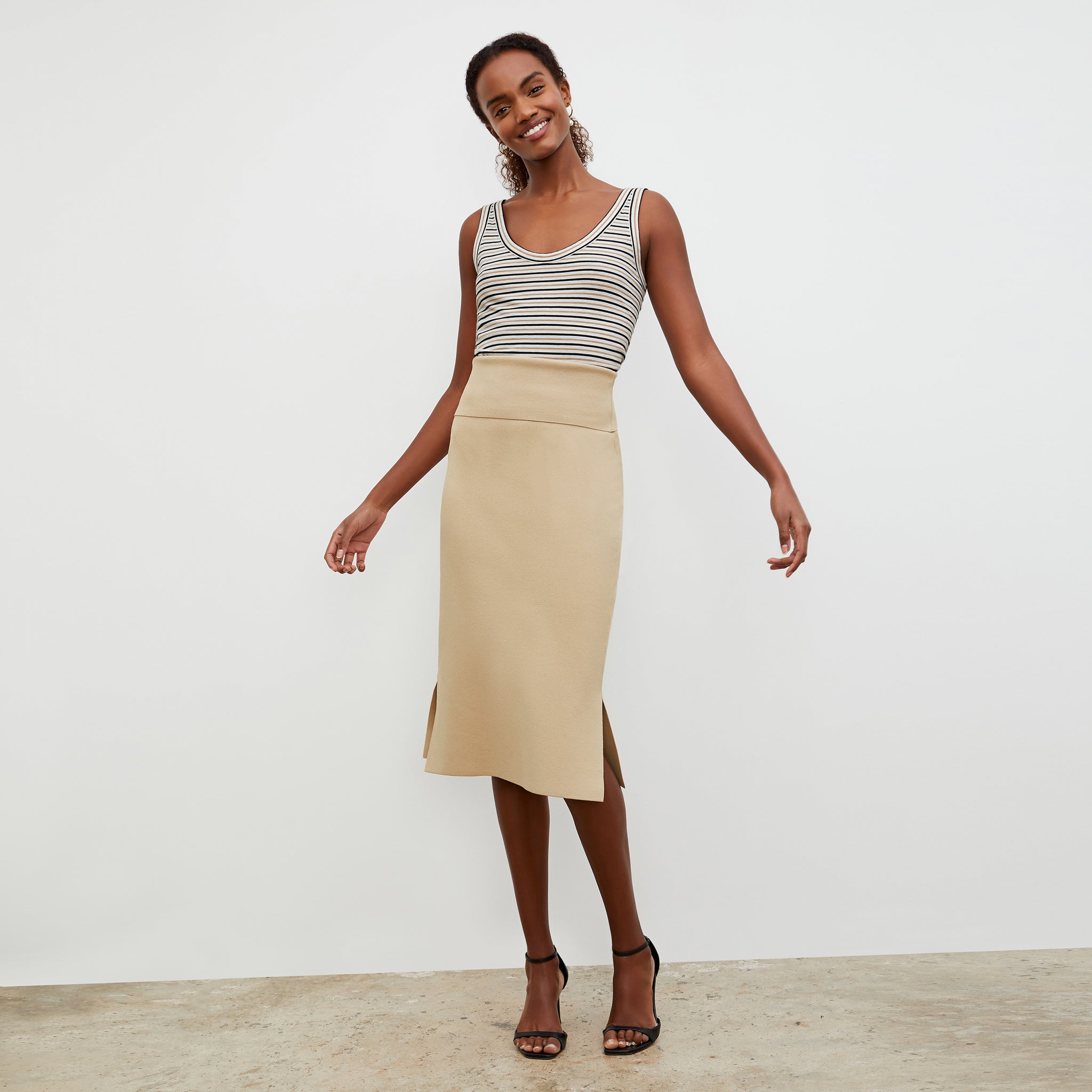 Front image of a woman wearing the Wyatt Tank - Thin Striped Pima Cotton in Tan / Black