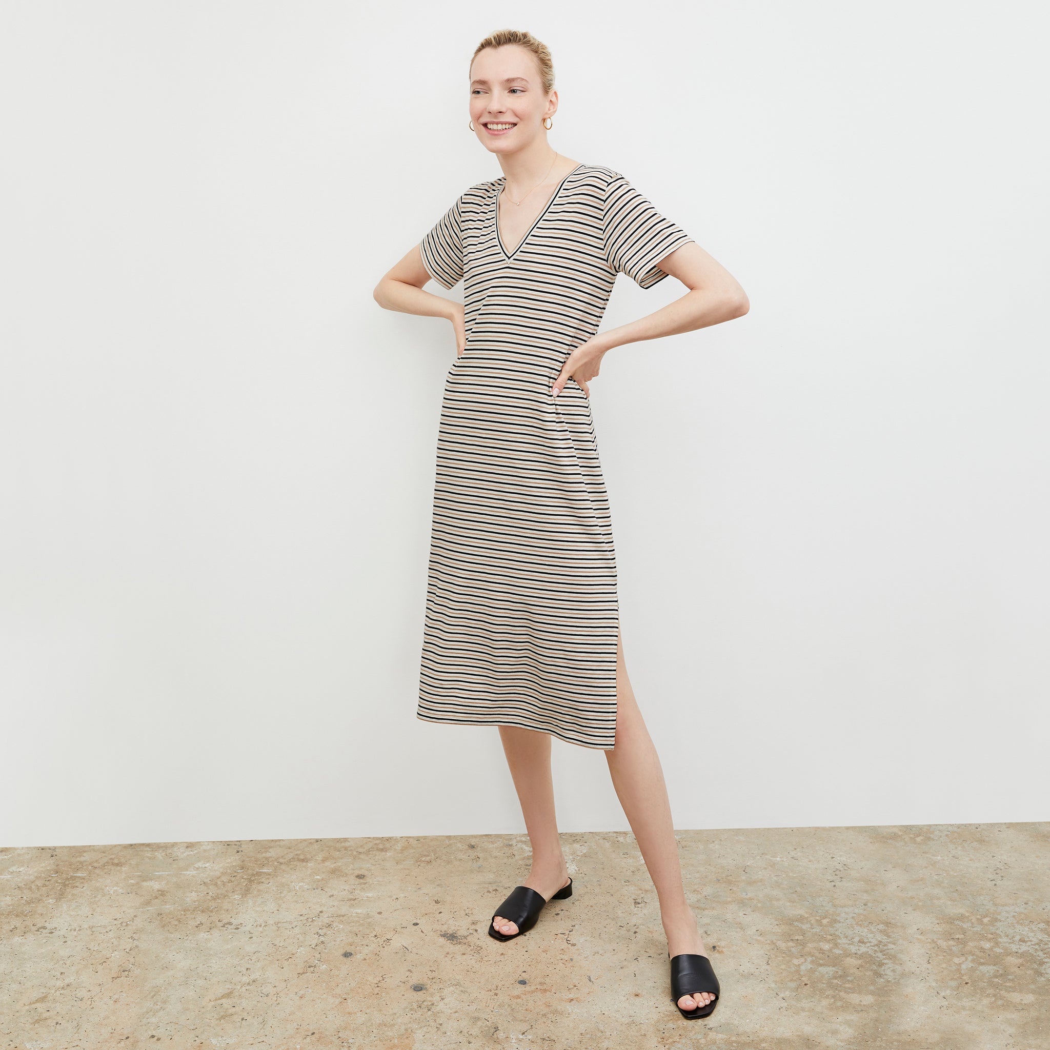 Front image of a woman wearing the Renee Dress - Thin Striped Pima Cotton in Tan / Black 