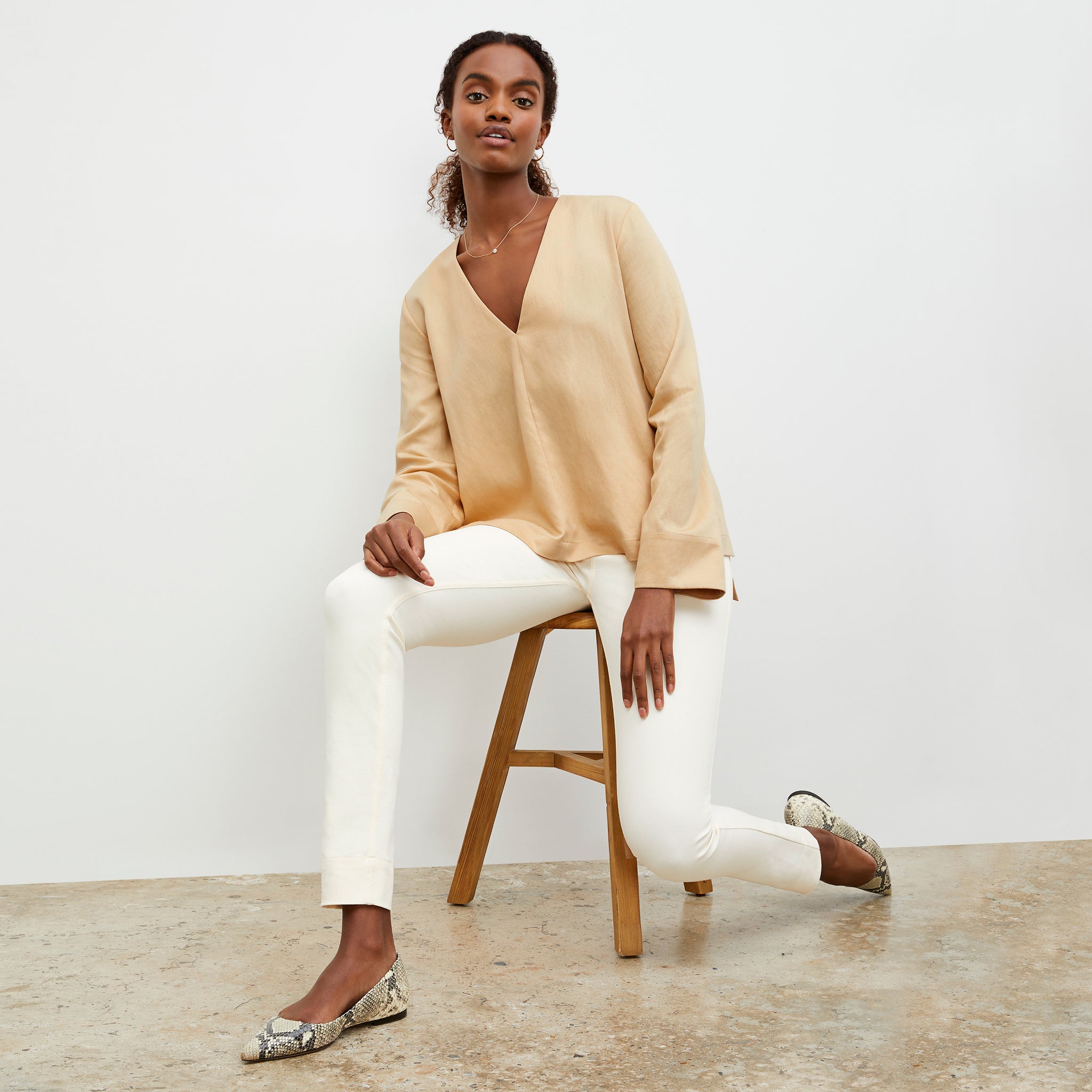 Front image of a woman wearing the Annette Top - Everyday Twill in Butter 